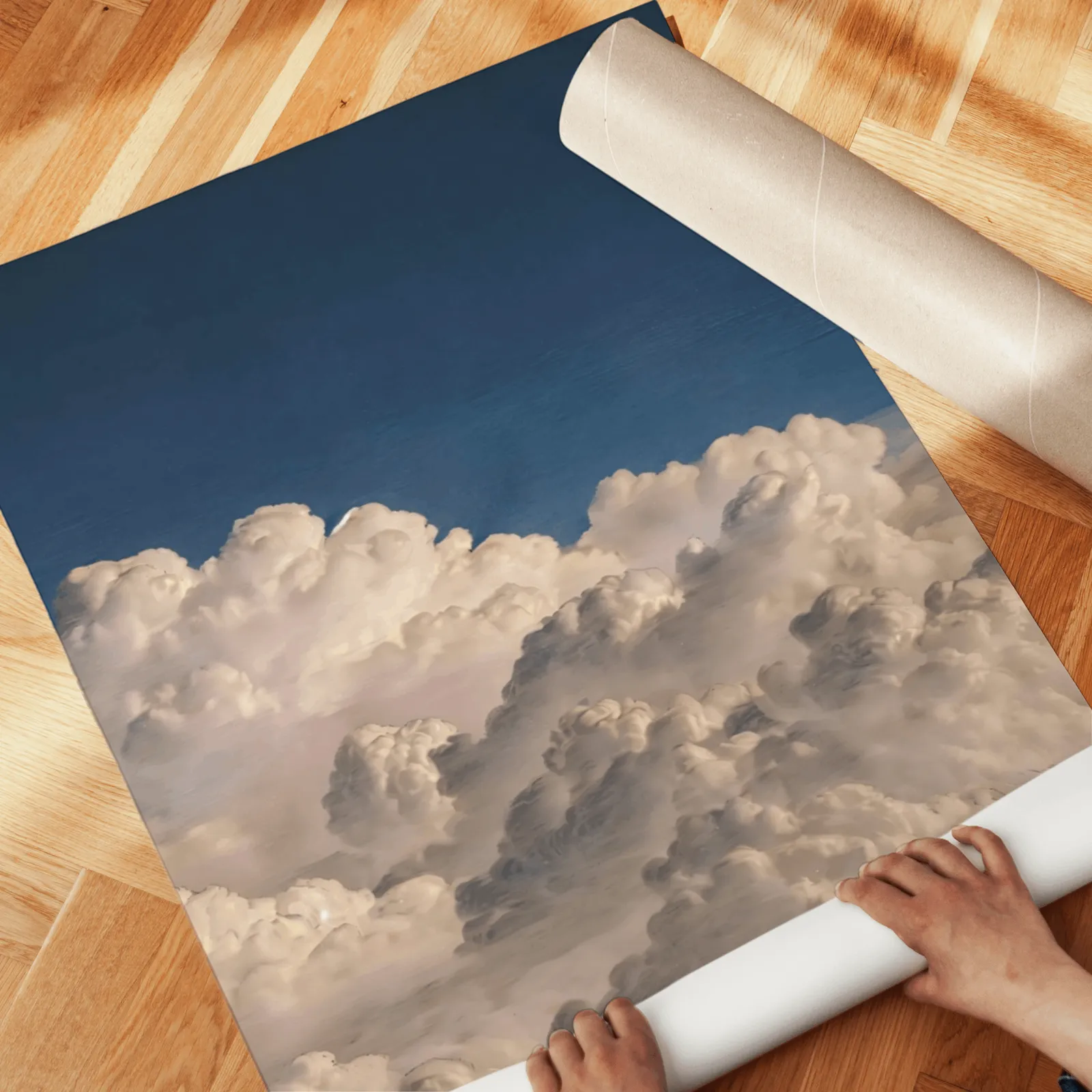 blue sky cloud landscape wall art set of two, unrolled across a herringbone parquet floor by hand