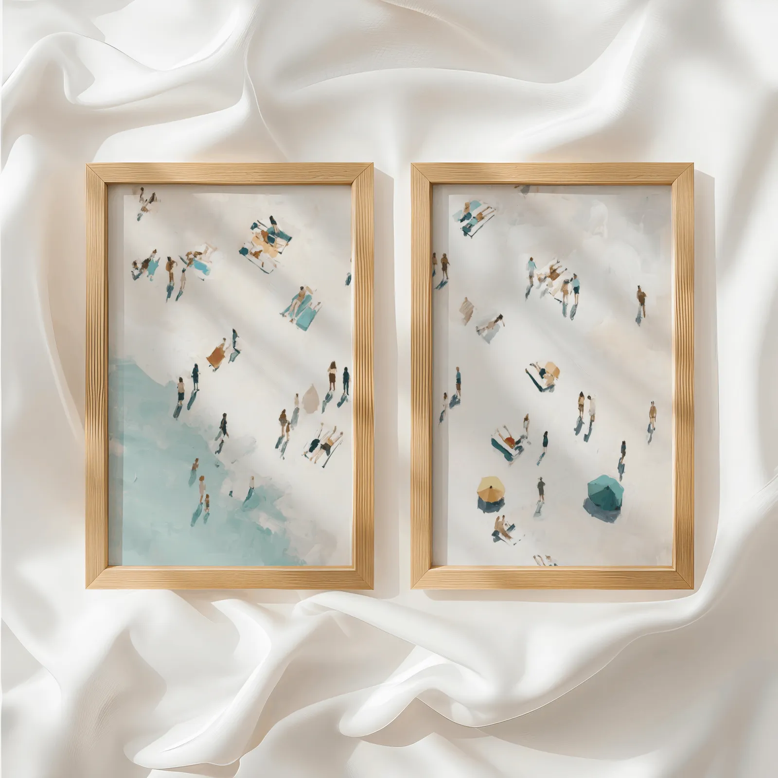 beach wall art set of 2 aerial coastal scene, side by side atop rumpled white silky fabric