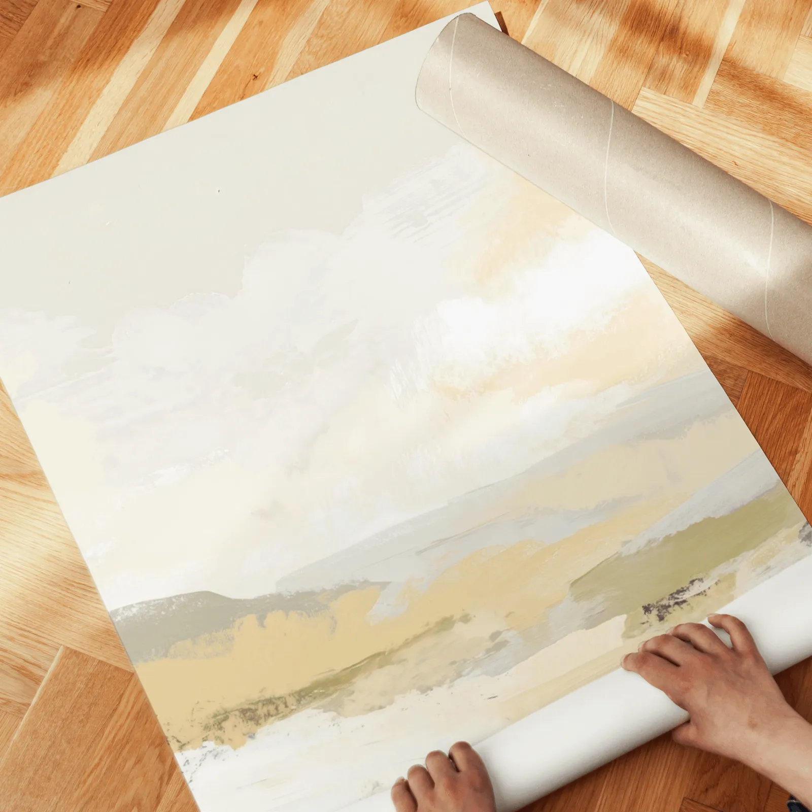 beige abstract landscape triptych wall art, unrolled across a herringbone wood floor by hand