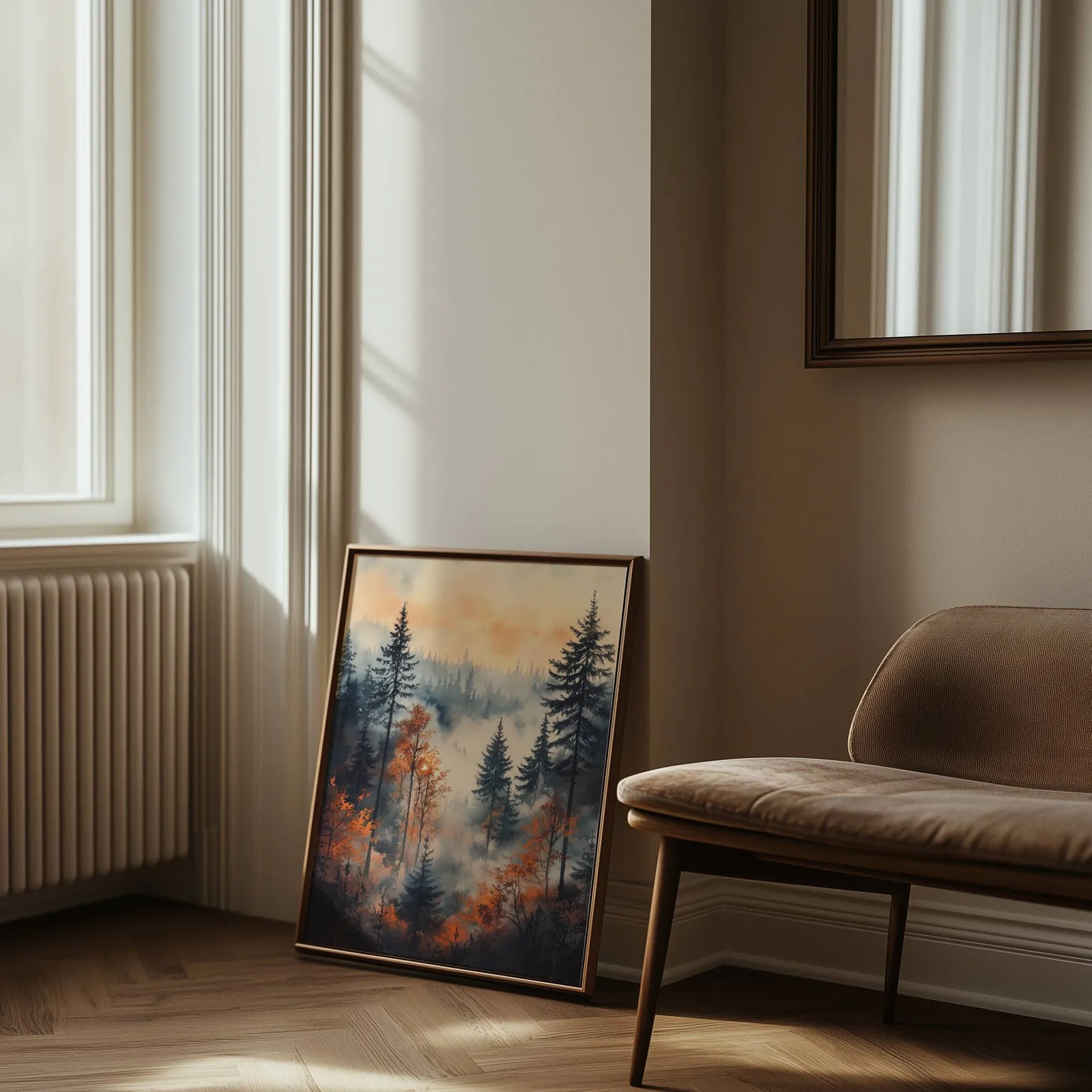 moody misty forest wall art in orange and grey, leaning against the wall beside a sunlit radiator and herringbone floor
