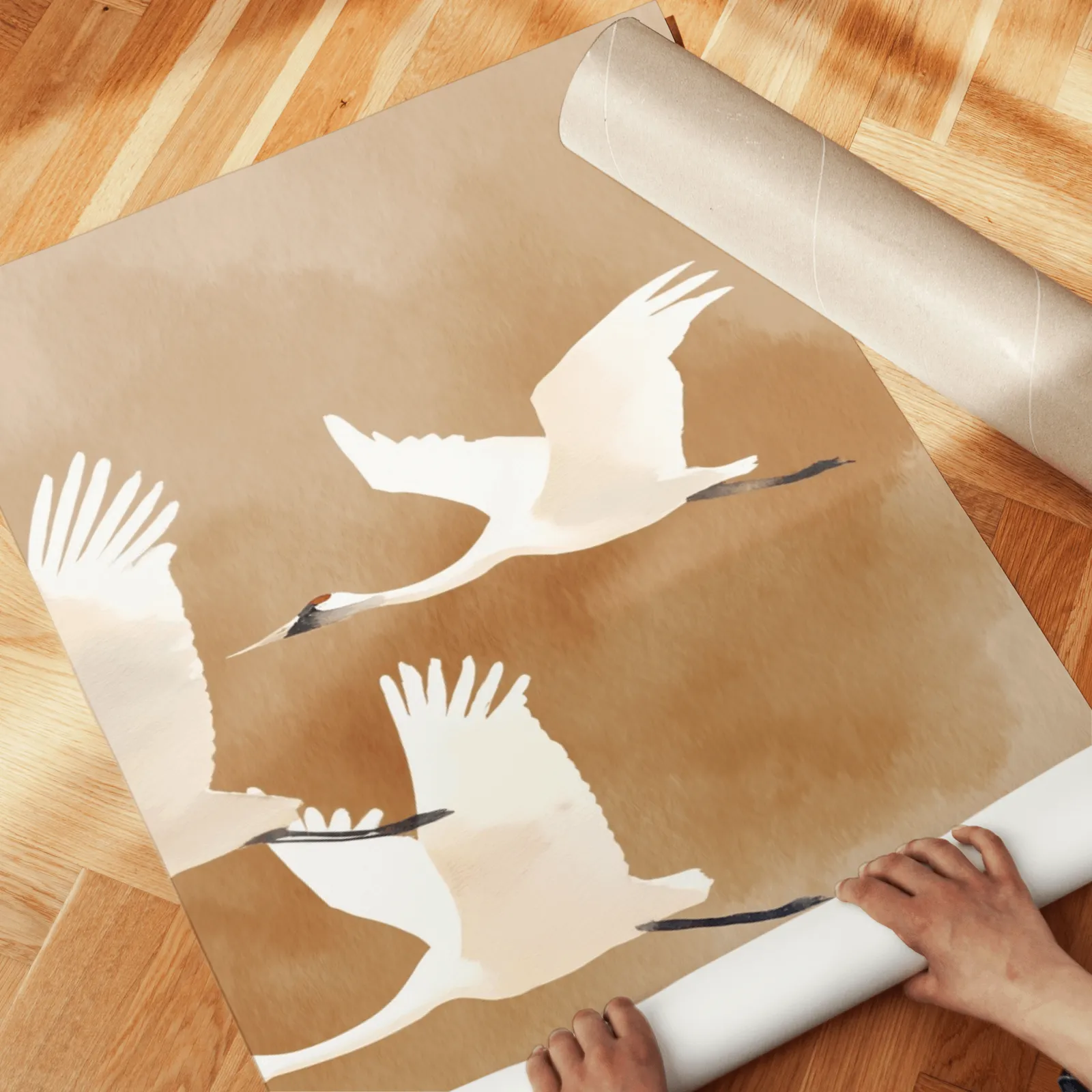 beige crane wall art set of two, unrolled across a herringbone parquet floor by hand