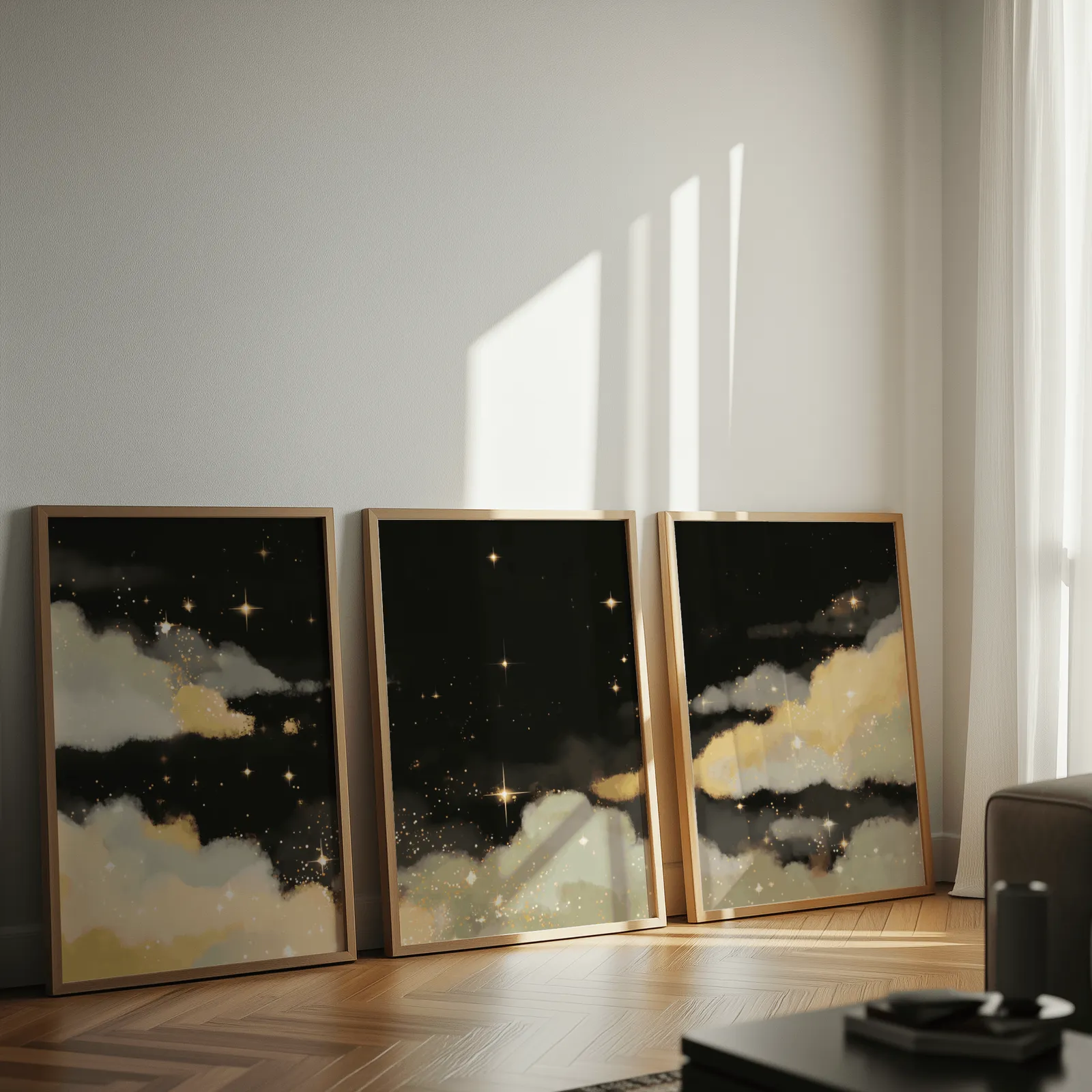 black and gold starry sky triptych wall art, leaning against a sunlit wall on herringbone flooring