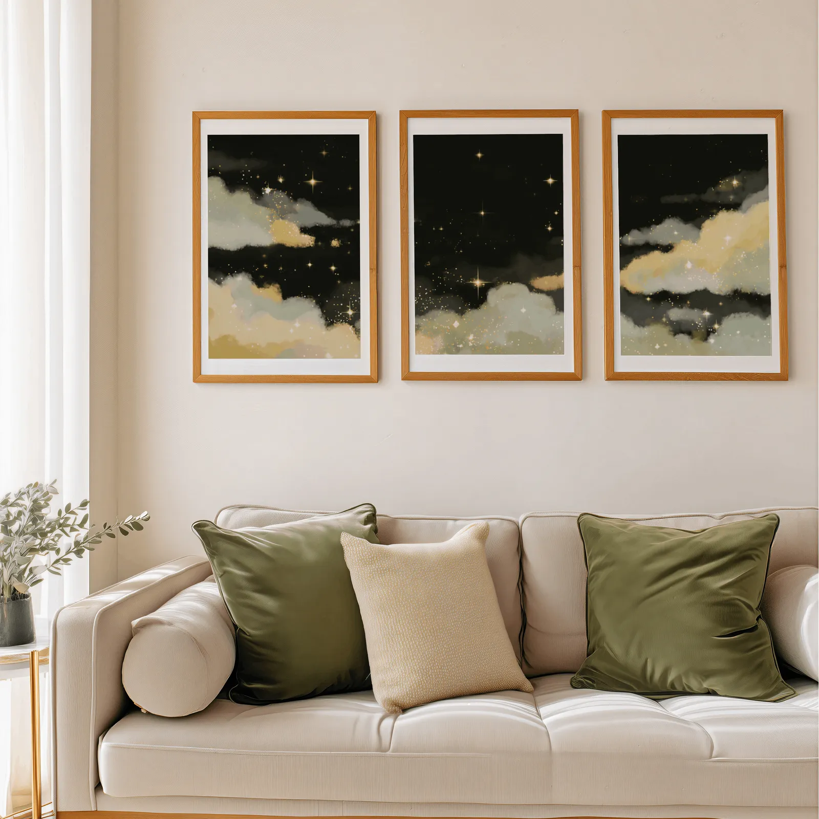 black and gold starry sky triptych wall art, above a beige sofa piled with olive green cushions