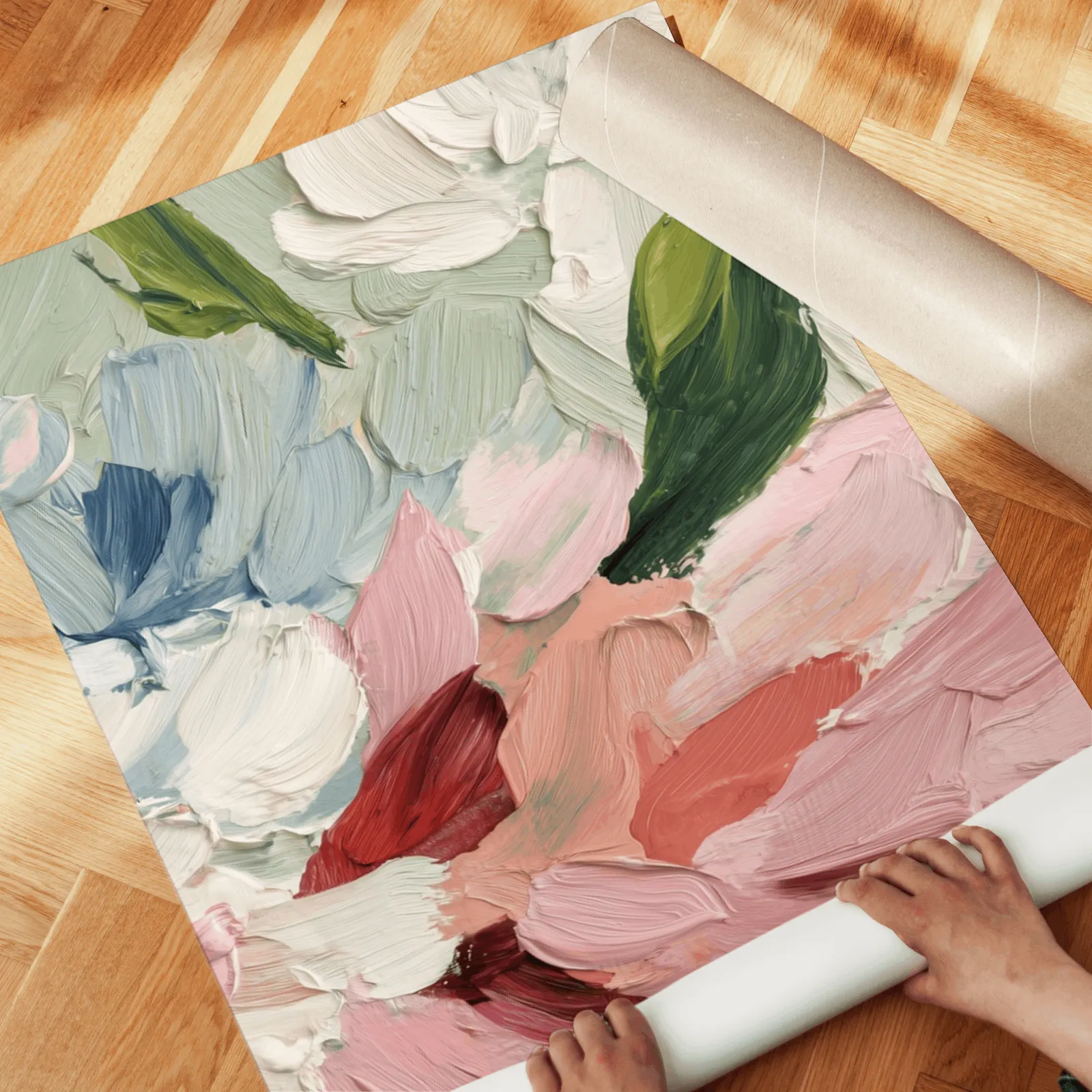 pink abstract floral wall art set of two, unrolled across a herringbone parquet floor by hand