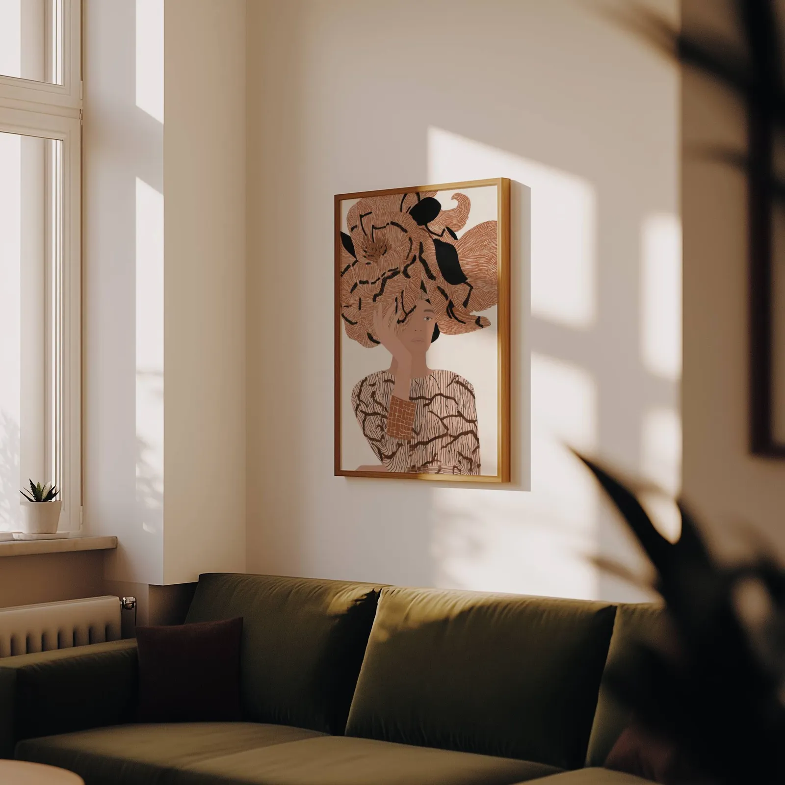 terracotta floral woman portrait abstract wall art, above an olive velvet sofa in raking afternoon light