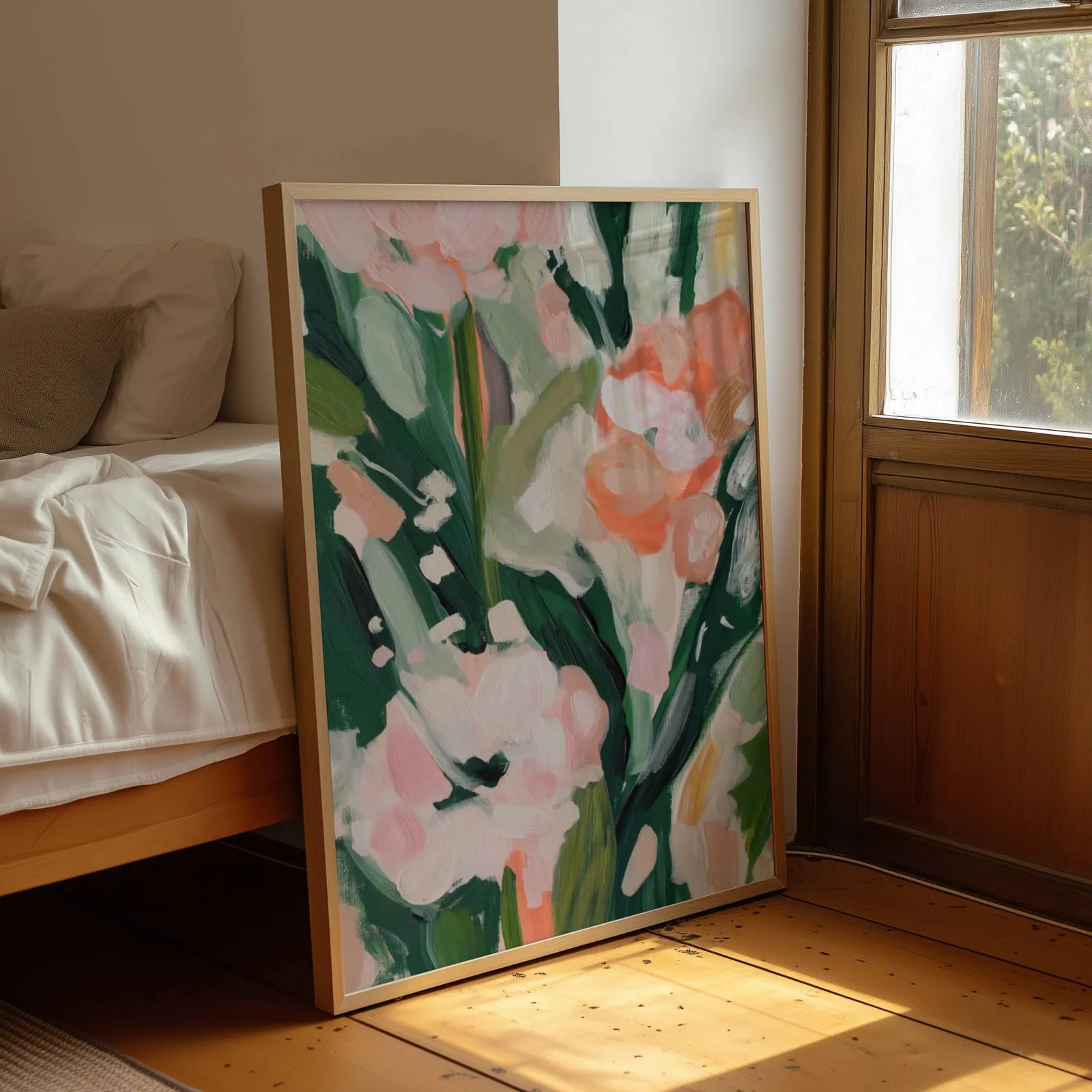 pink floral botanical wall art, leaning by a sunlit window beside an unmade bed