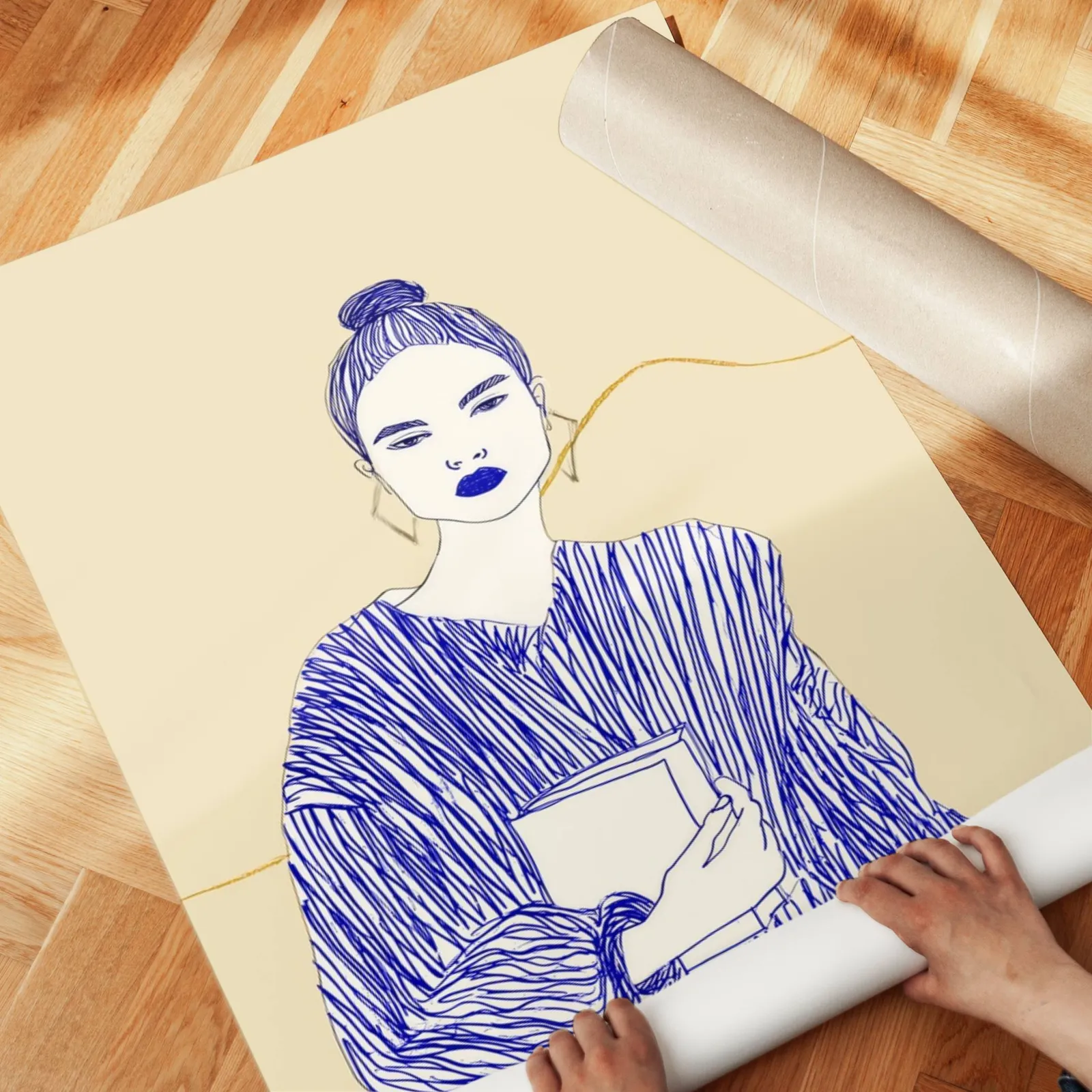 blue line art woman reading wall art, unrolled across a herringbone parquet floor by hand