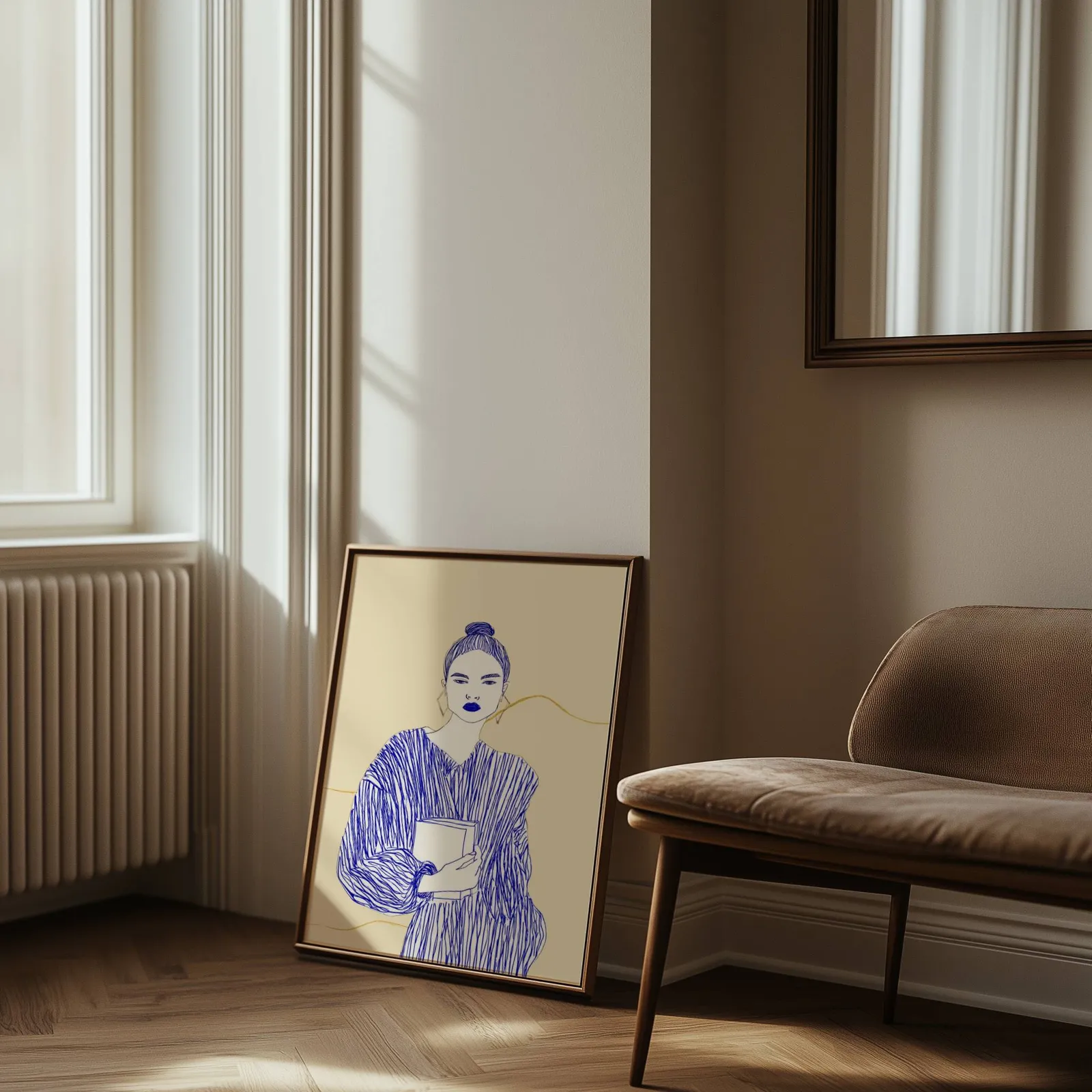blue line art woman reading wall art, leaning against the wall beside a sunlit radiator and herringbone floor