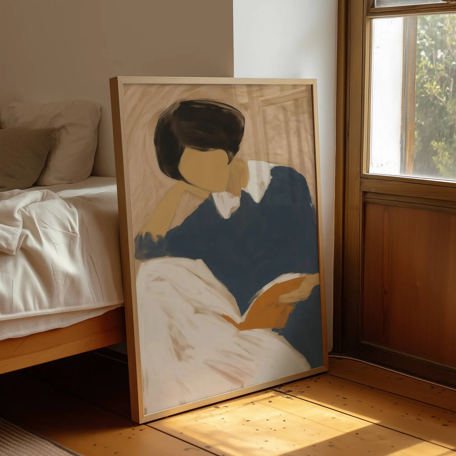 blue reading figure minimalist wall art, leaning by a sunlit window beside an unmade bed