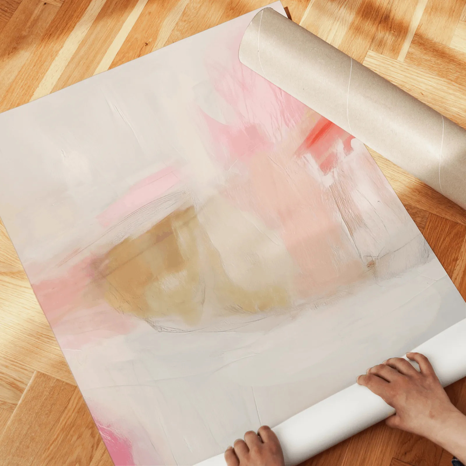 pink abstract triptych wall art set, unrolled across a herringbone wood floor by hand