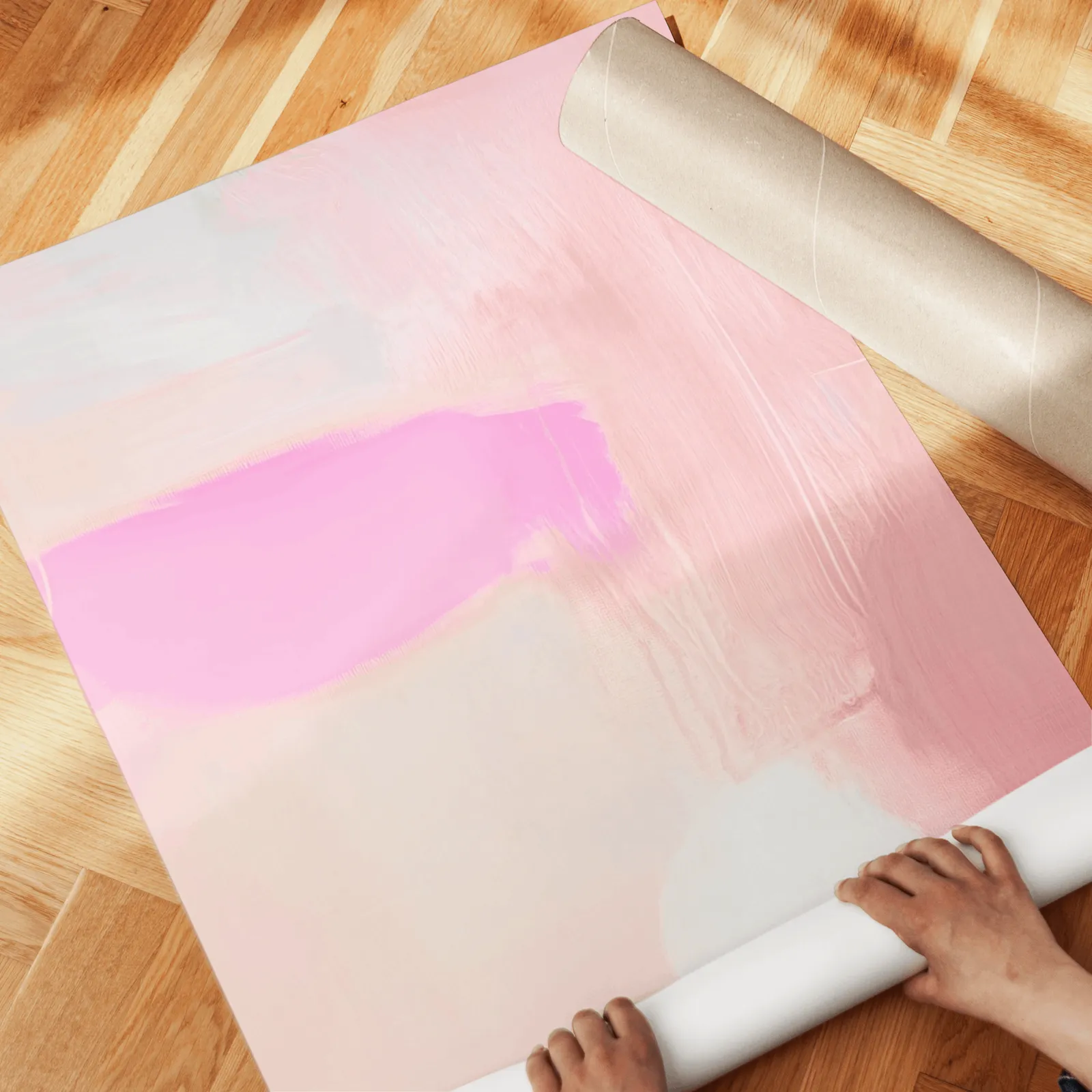 pink abstract set of 3 wall art, unrolled across a herringbone wood floor by hand