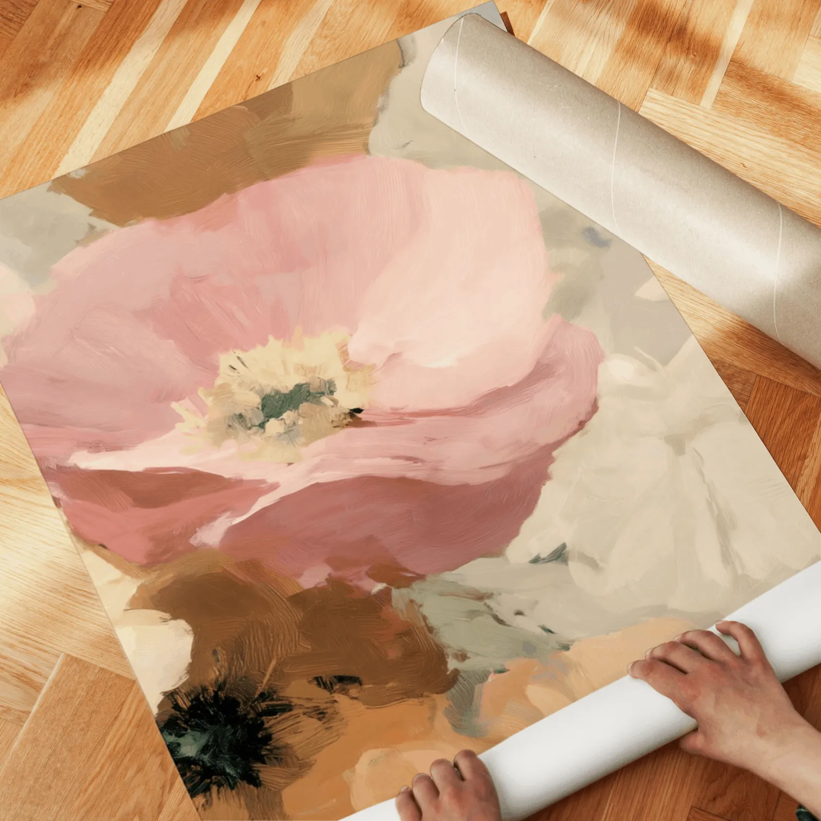 pink floral wall art set of two, unrolled across a herringbone parquet floor by hand