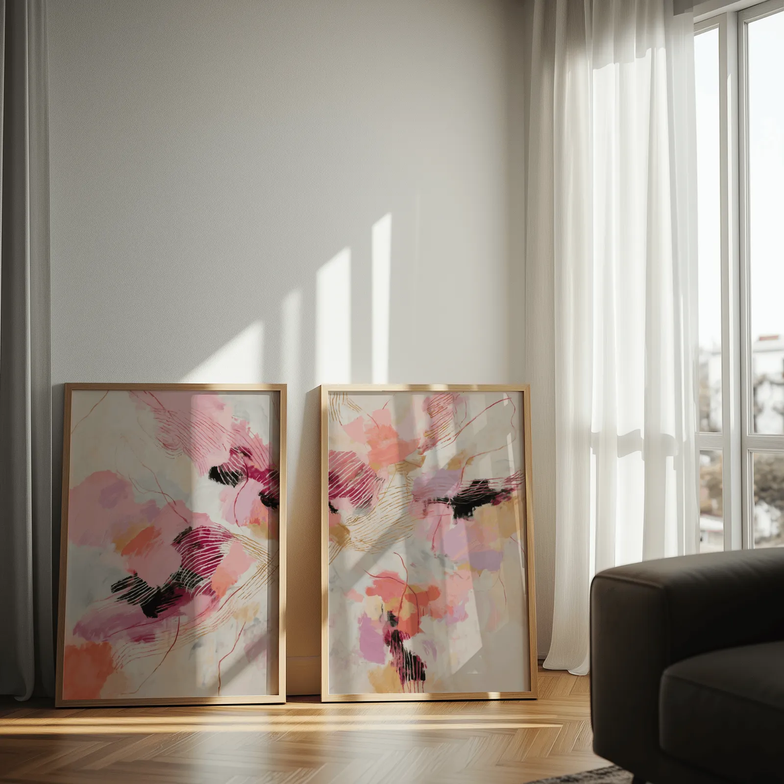 pink and orange abstract wall art set, leaning against a sunlit wall by sheer curtains
