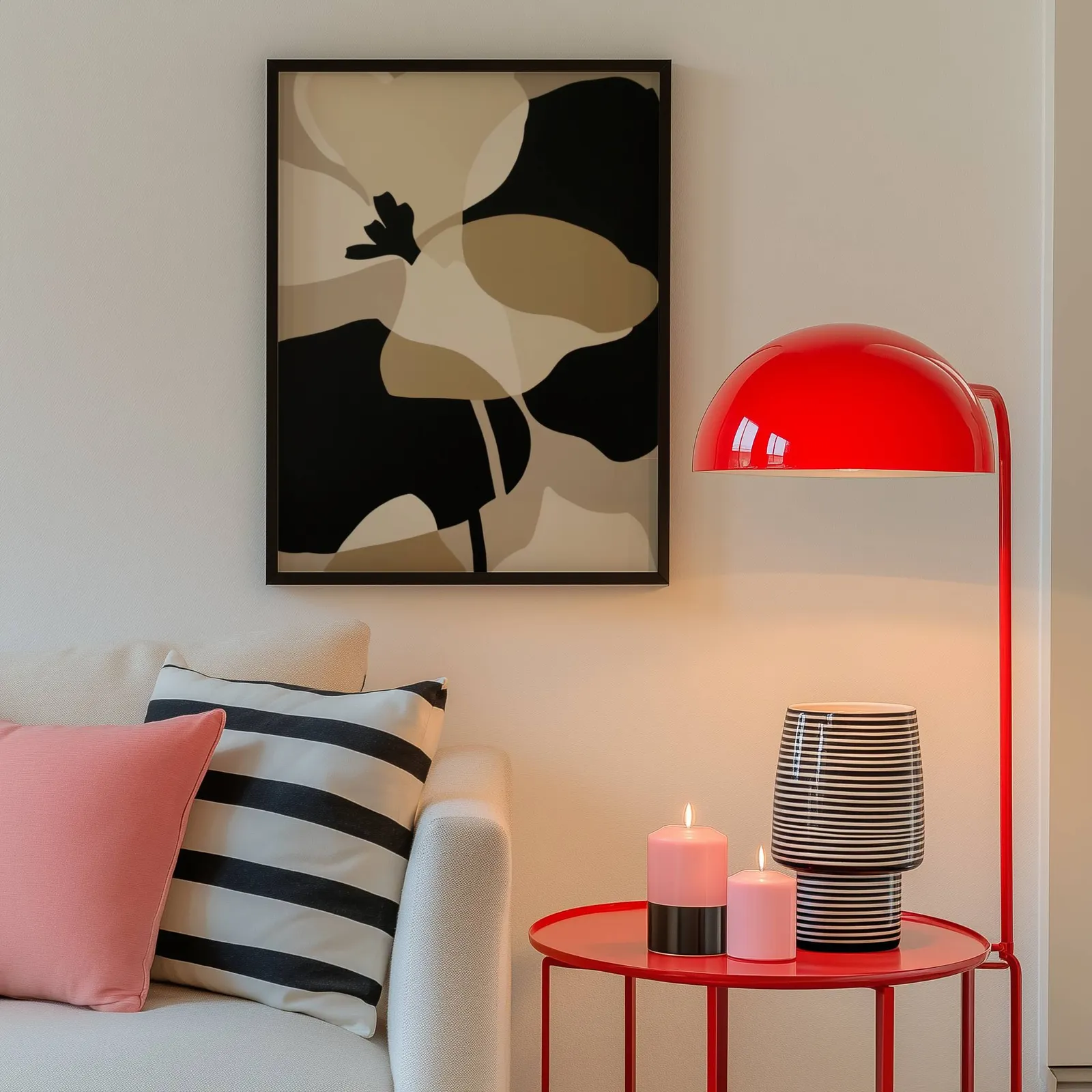 black and beige abstract botanical wall art, above a cream sofa beside a glossy red dome lamp