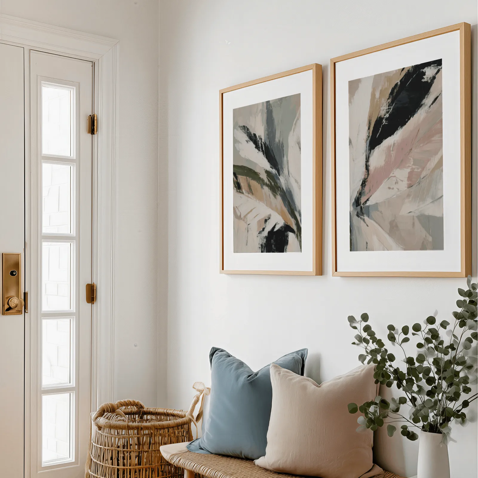 pink and green abstract botanical wall art set of 2, above a bench with blue and blush pillows near the entry door