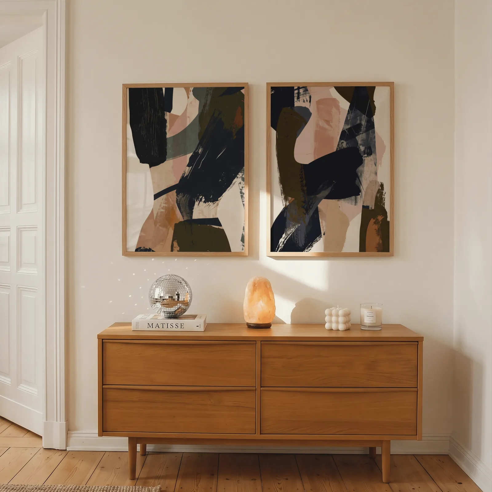 blue terracotta abstract wall art set of 2, above a wooden dresser with a salt lamp and disco ball