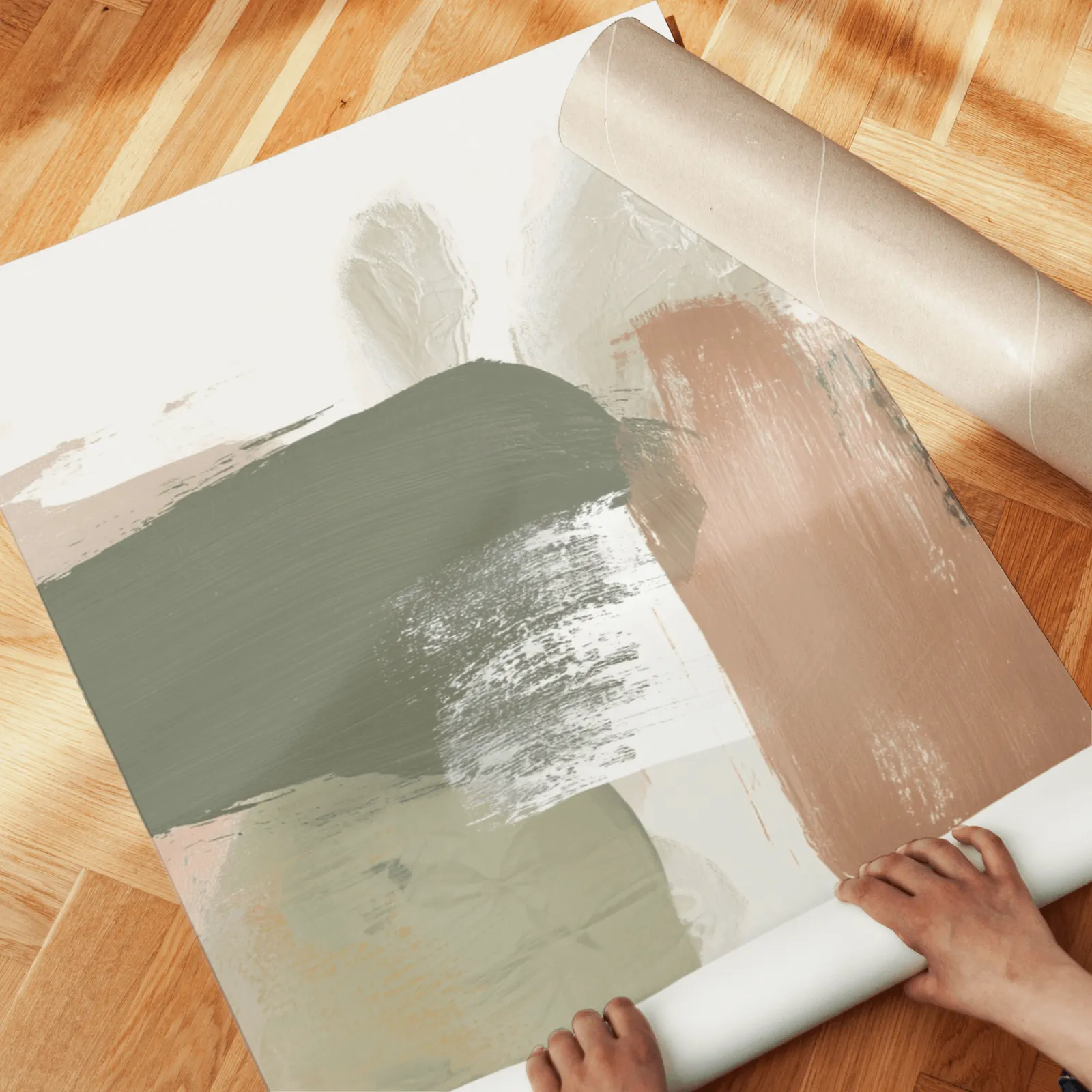 terracotta green abstract wall art set of 3, unrolled across a herringbone wood floor by hand