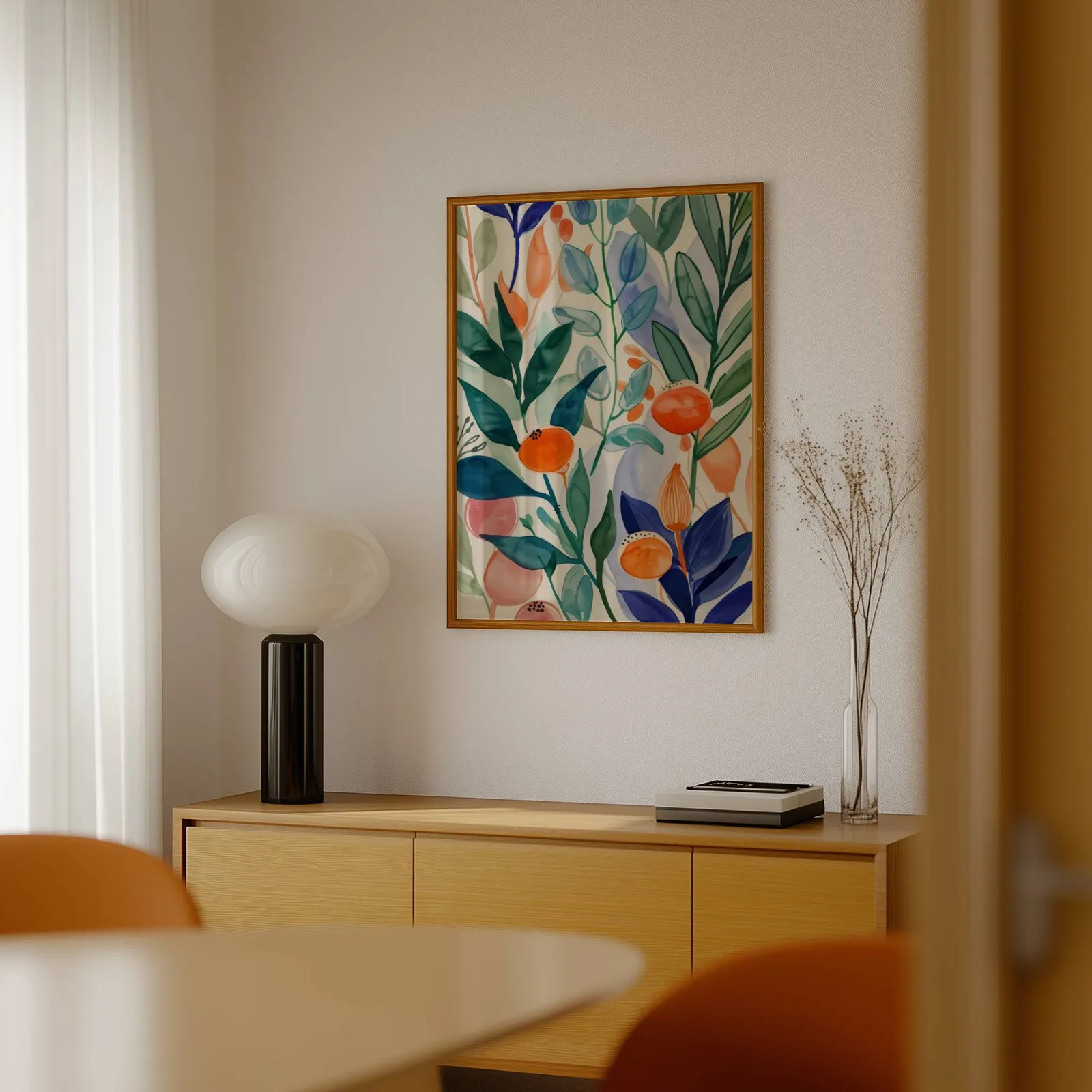 colorful botanical floral wall art, above a light wood sideboard beside a bulbous black lamp