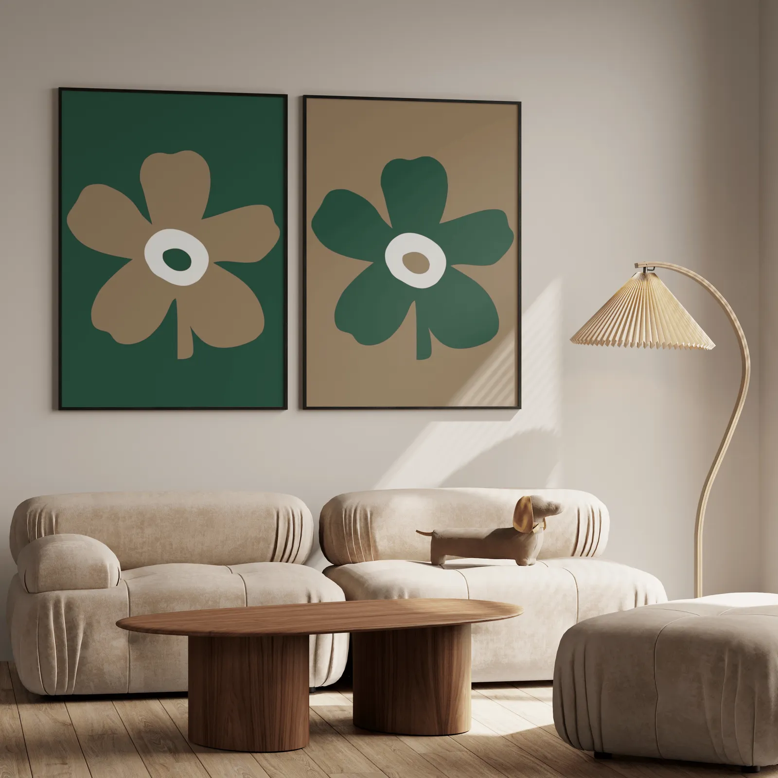 green and brown botanical flower wall art set of two, above a plush beige sofa with a pleated lamp nearby