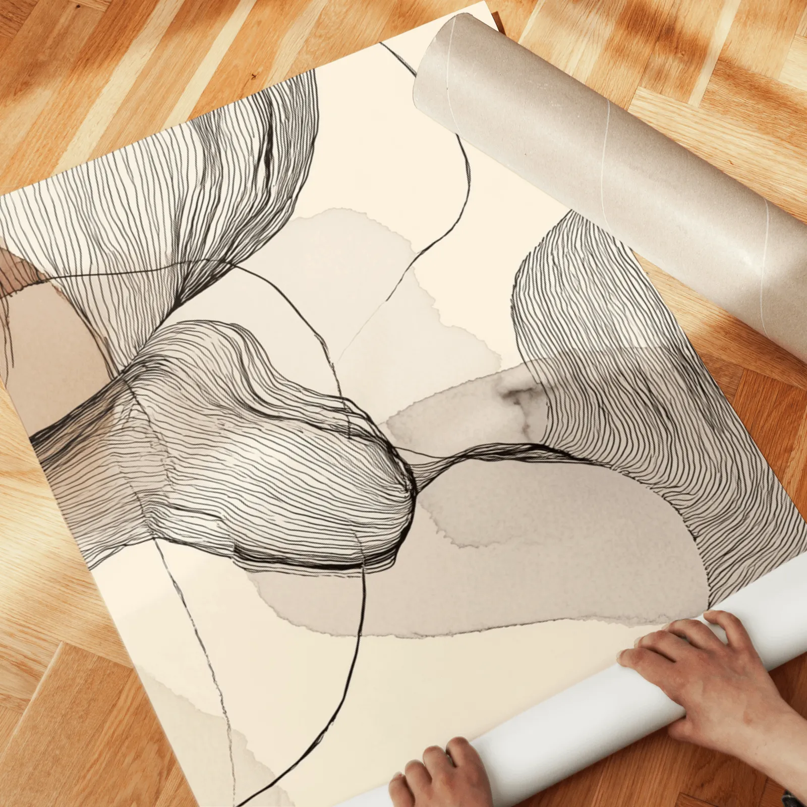 neutral abstract line art set of three, unrolled across a herringbone wood floor by hand