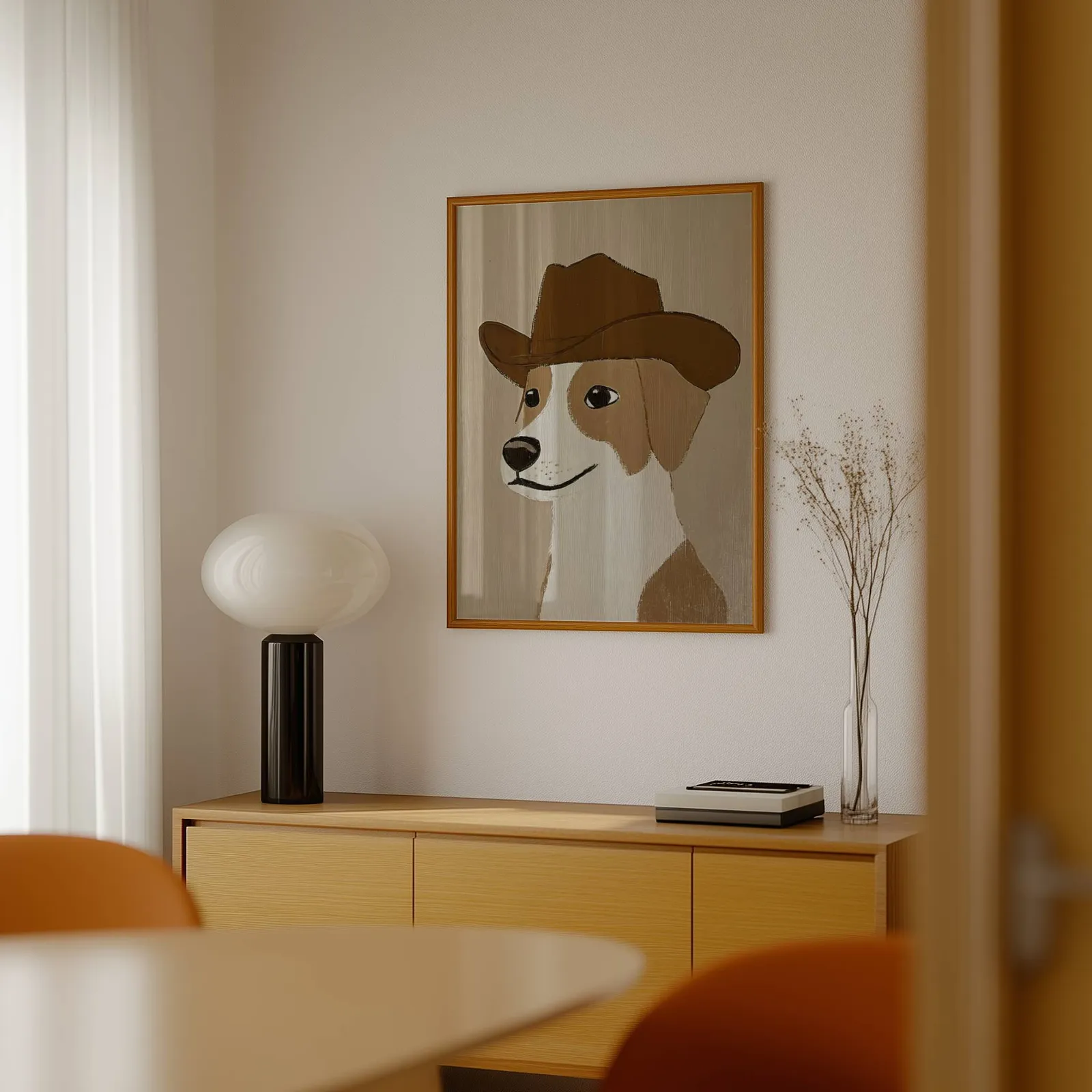 cowboy dog portrait western wall art, above a light wood sideboard beside a bulbous black lamp