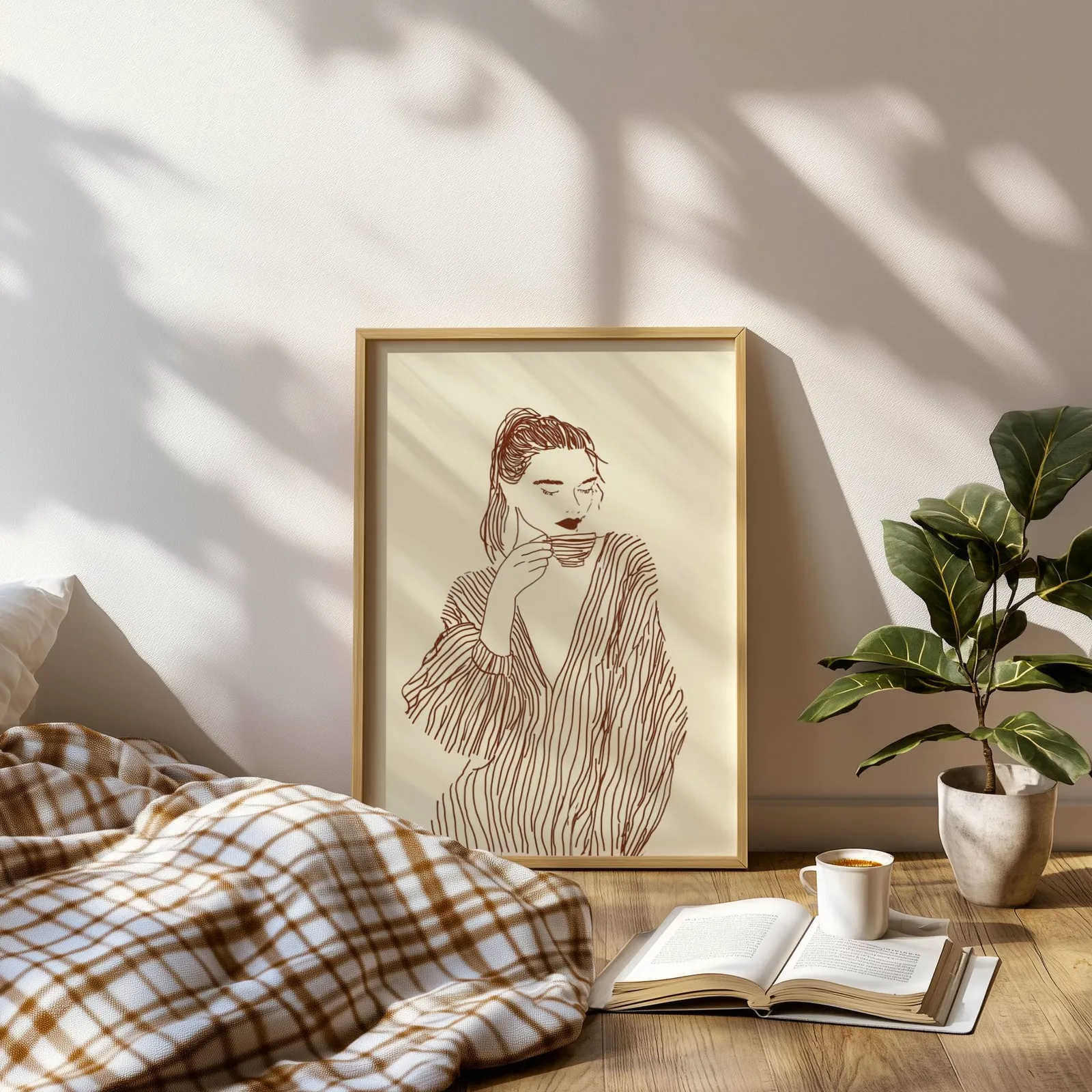 woman drinking coffee line art print, leaning on a sunlit floor beside a plaid blanket and open book
