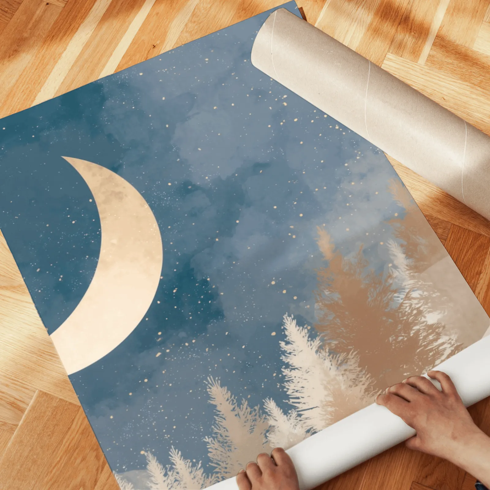 blue forest wall art set with crescent moon, unrolled across a herringbone parquet floor by hand