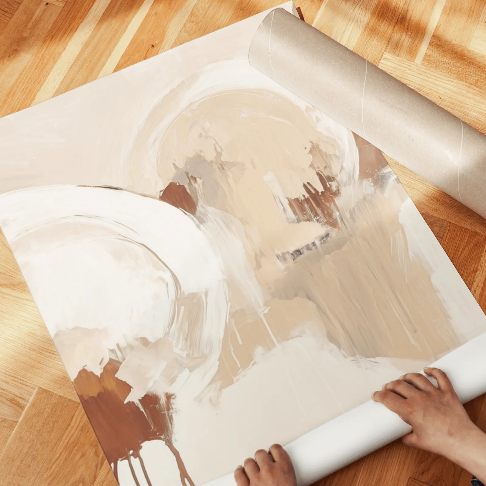 terracotta and grey abstract wall art set of 3, unrolled across a herringbone wood floor by hand