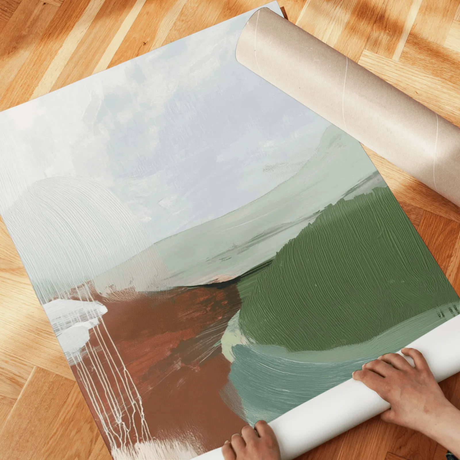 green terracotta abstract wall art set of 3, unrolled across a herringbone wood floor by hand