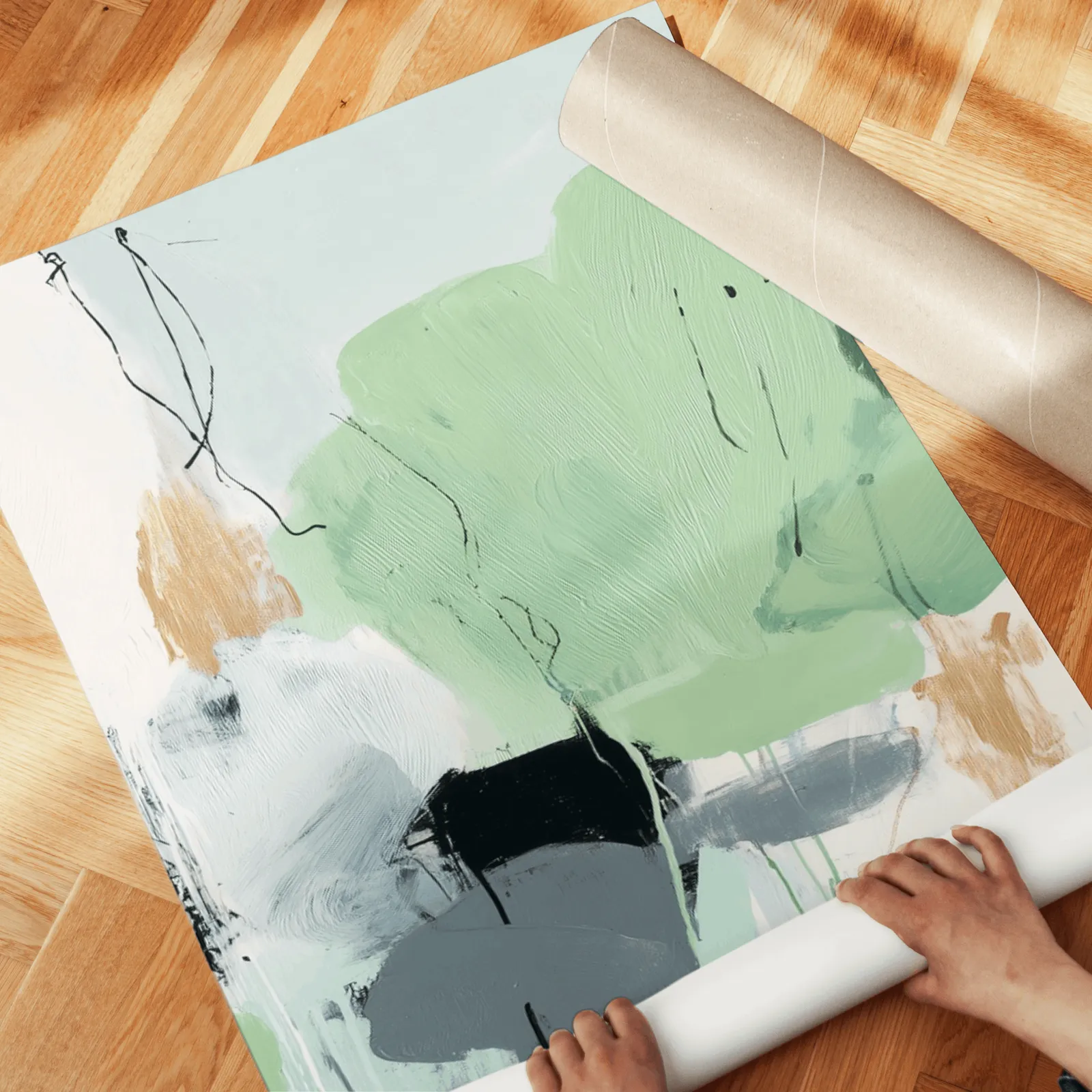green abstract three piece wall art with black accents, unrolled across a herringbone wood floor by hand
