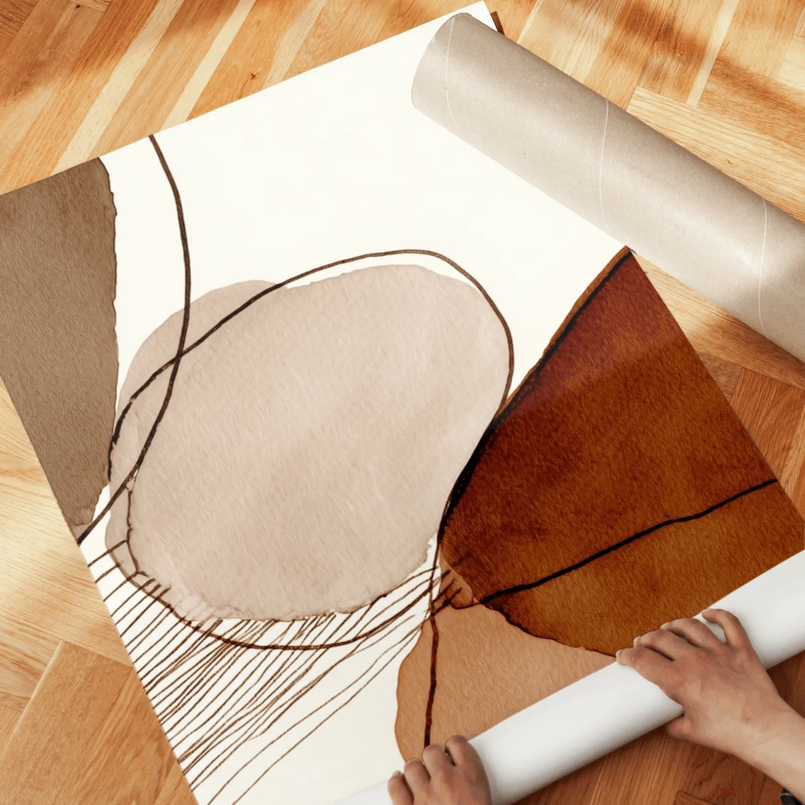 terracotta abstract wall art set of 3, unrolled across a herringbone wood floor by hand