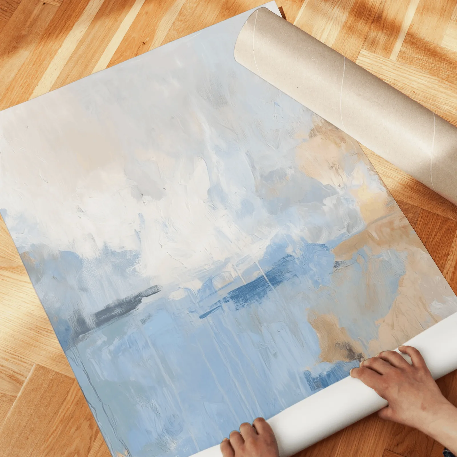 blue abstract three piece wall art, unrolled across a herringbone wood floor by hand