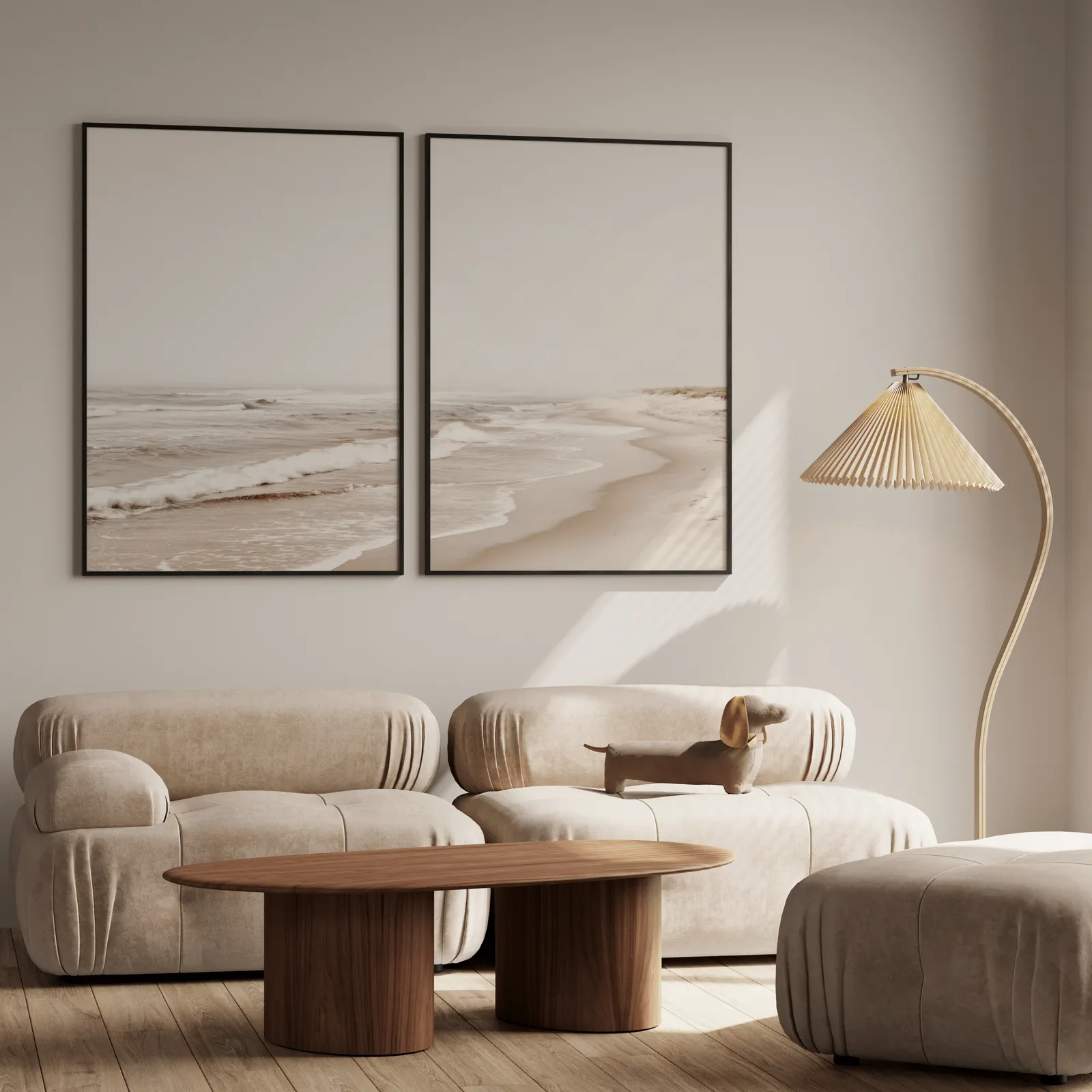 neutral beach wall art set of two coastal prints, above a plush beige sofa with a pleated lamp nearby