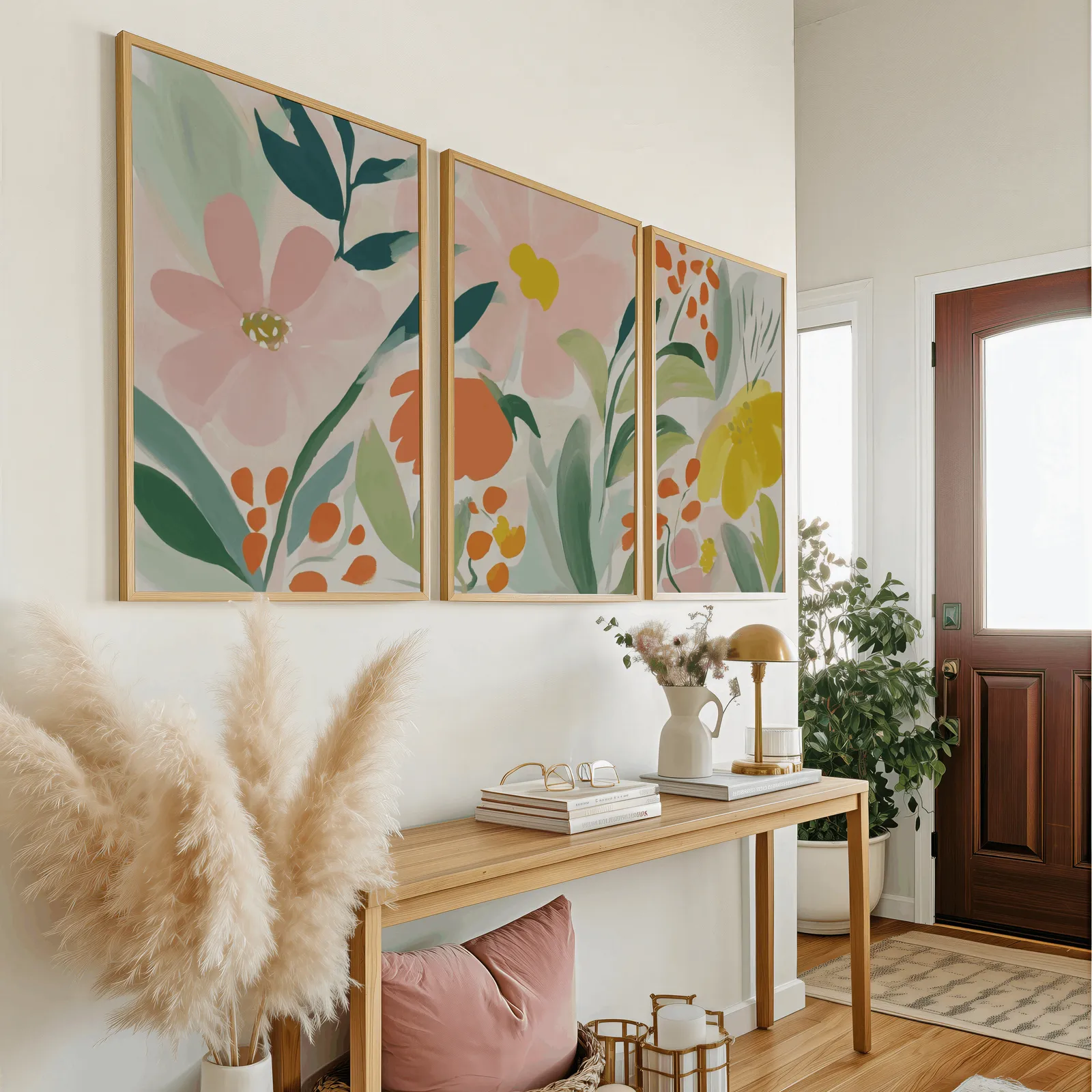 colorful floral botanical wall art set of 3, above a wooden console table near the entry door