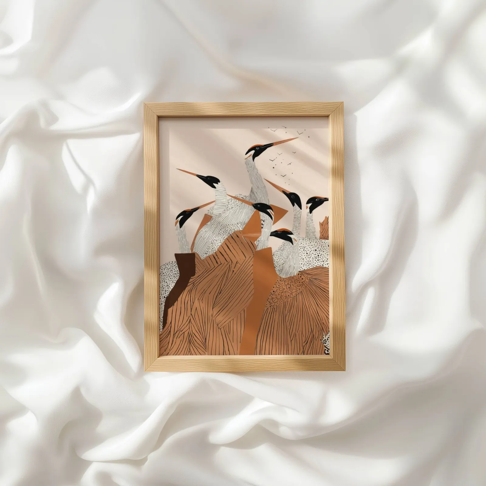 terracotta crane flock nature wall art, resting atop rumpled white silky fabric