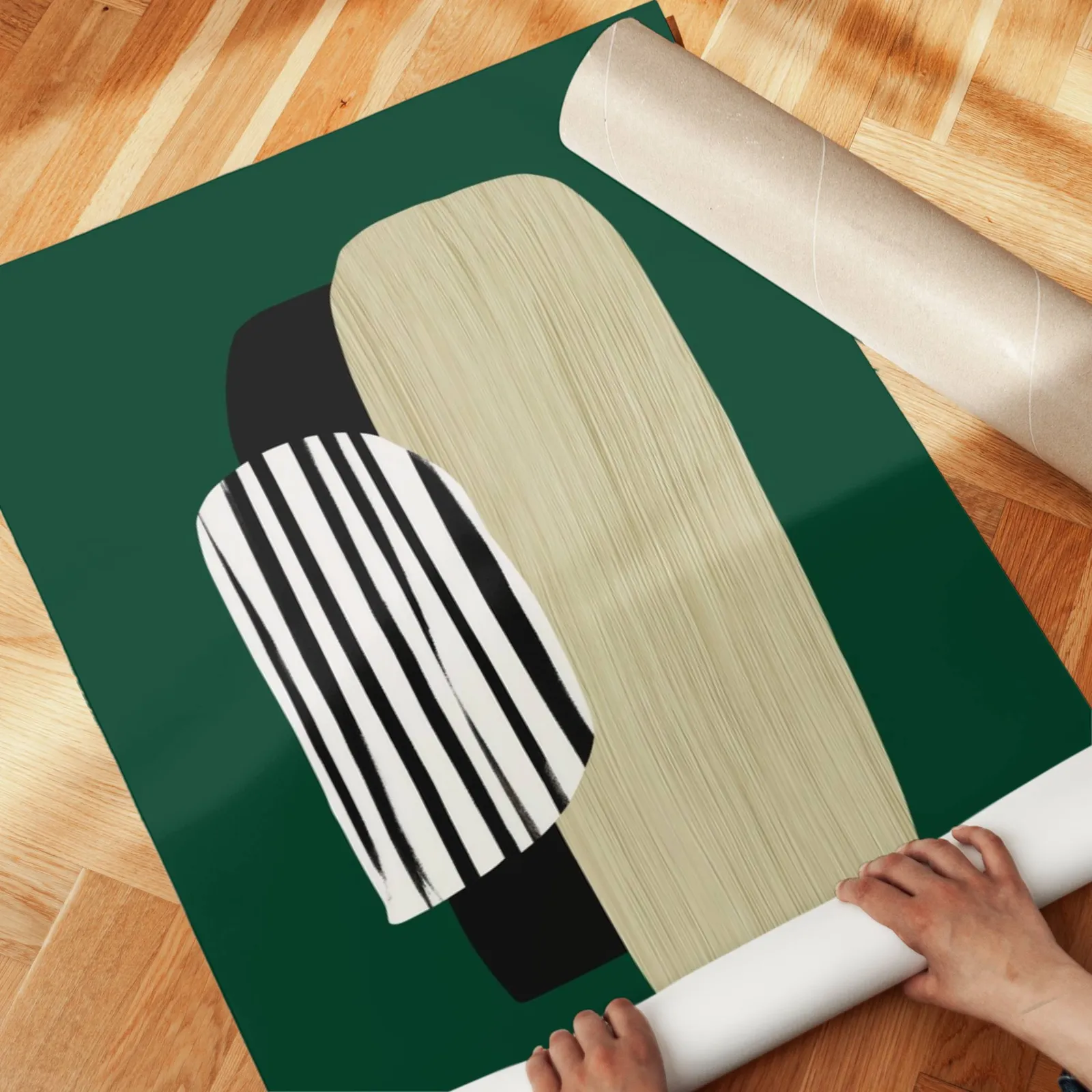 green abstract minimalist wall art with totem shapes, unrolled across a herringbone parquet floor by hand