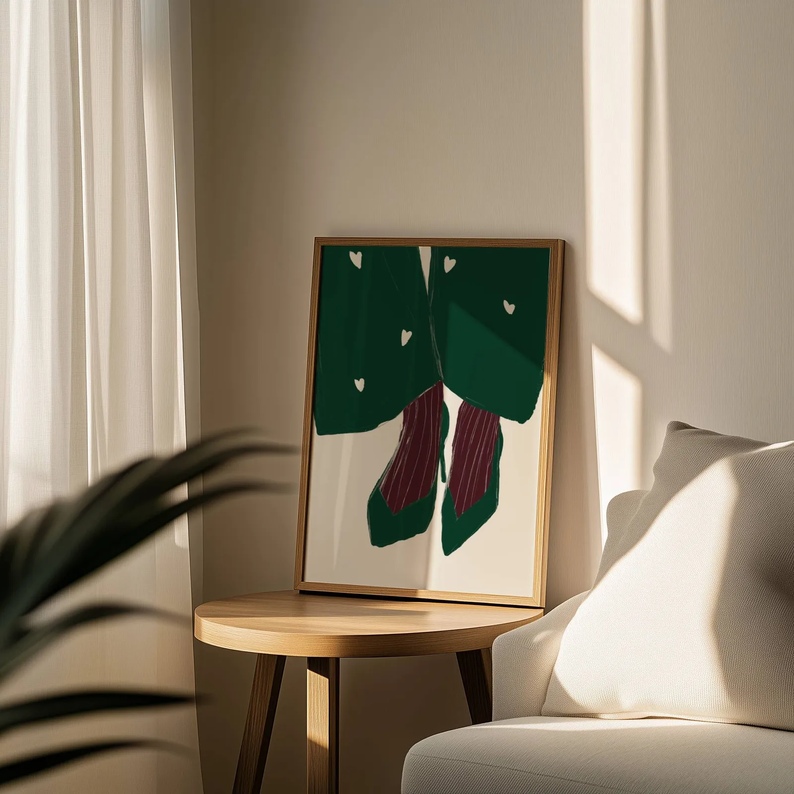 green heart pattern coat with burgundy heels wall art, leaning on a round wooden side table by a sheer curtain