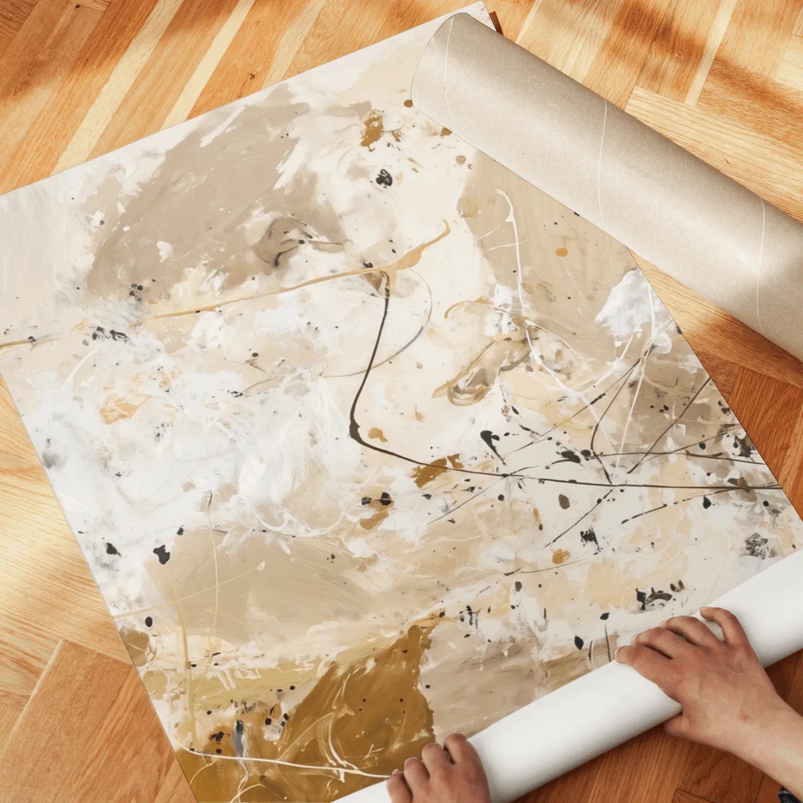 beige and black abstract triptych wall art, unrolled across a herringbone wood floor by hand