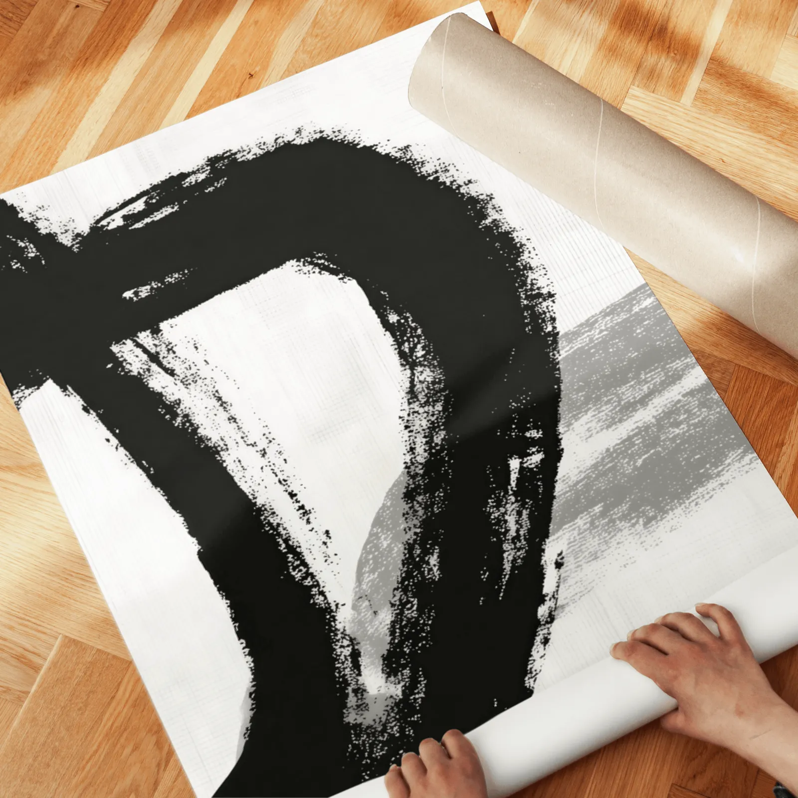 black and white minimalist brushstroke triptych wall art, unrolled across a herringbone wood floor by hand