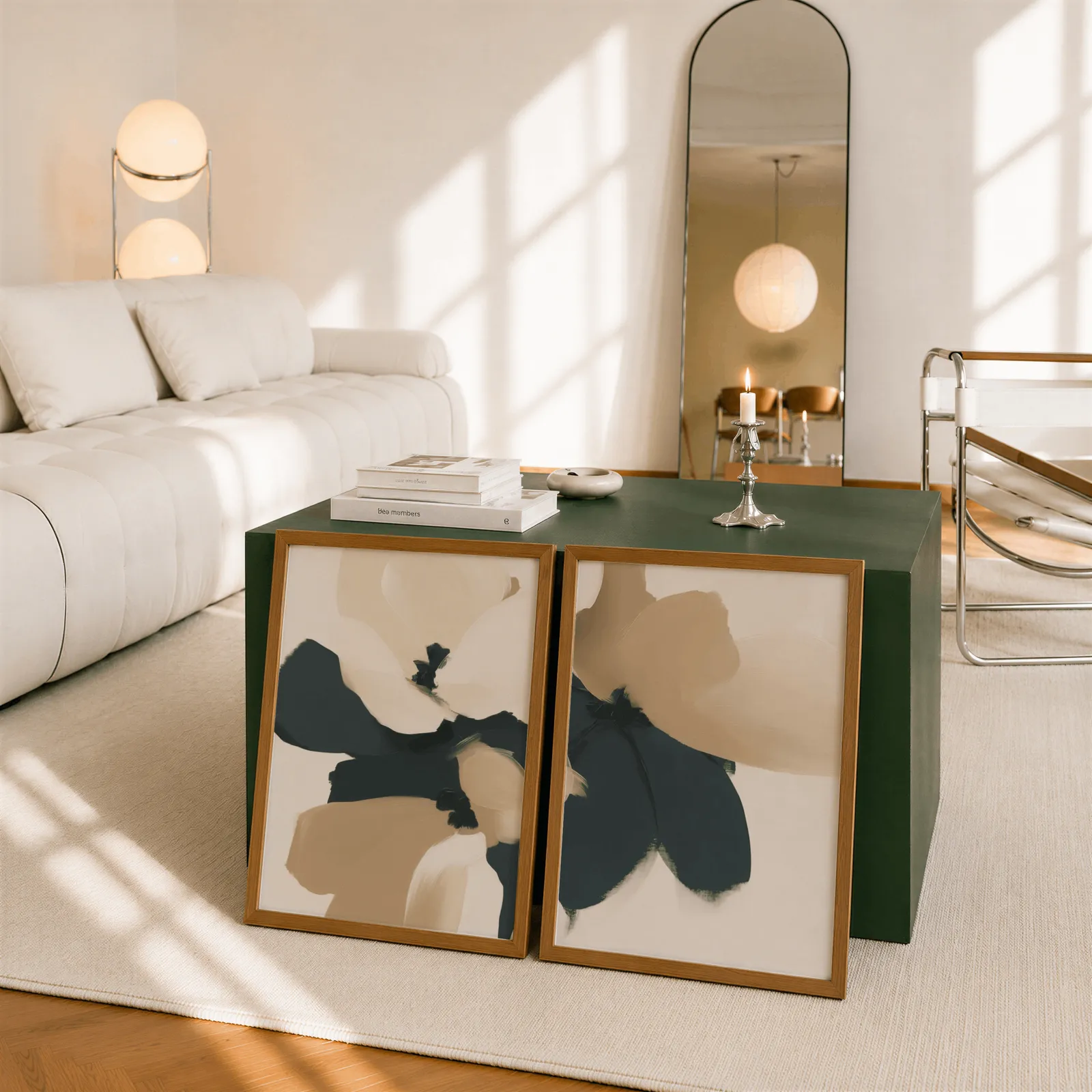beige and black abstract floral wall art set of 2, leaning against a dark green cube table beside an arched mirror