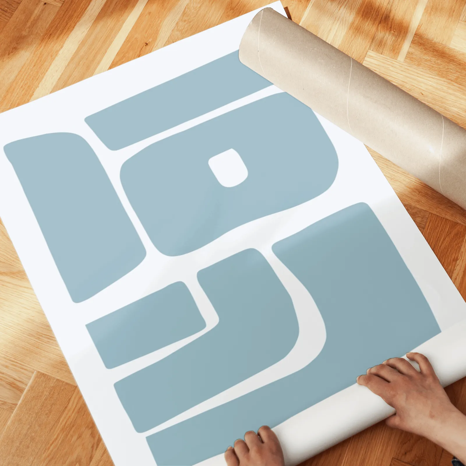 blue abstract minimalist wall art set of 2, unrolled across a herringbone parquet floor by hand