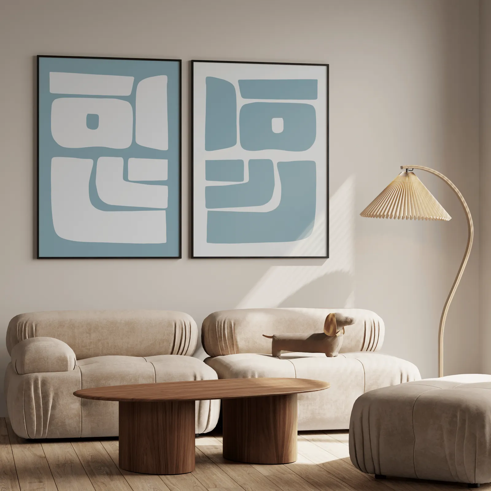 blue abstract minimalist wall art set of 2, above a plush beige sofa with a pleated lamp nearby