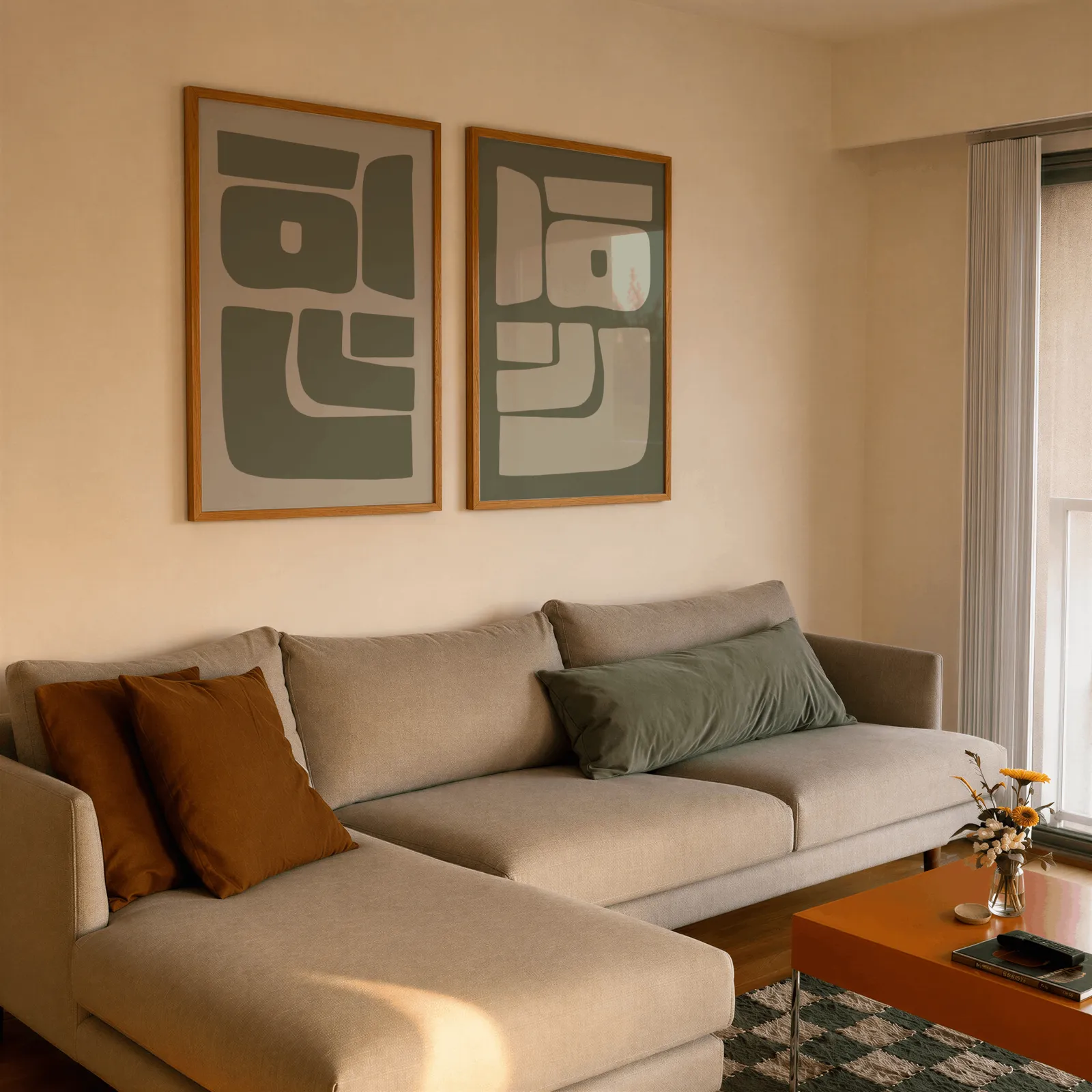 green abstract minimalist wall art set of two, side by side above a beige sectional sofa