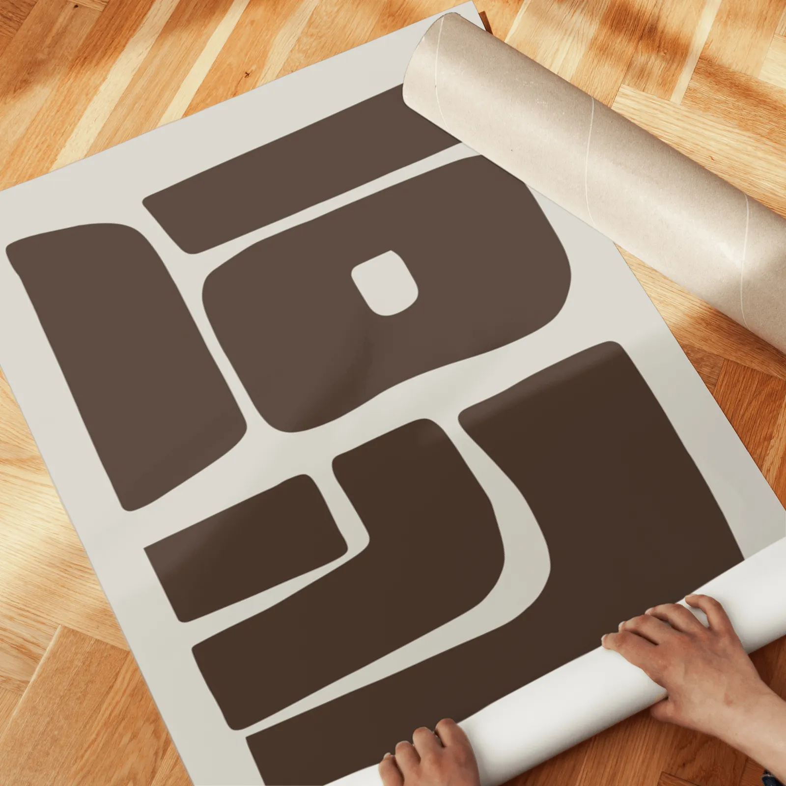 brown beige abstract mid-century wall art set of 2, unrolled across a herringbone parquet floor by hand
