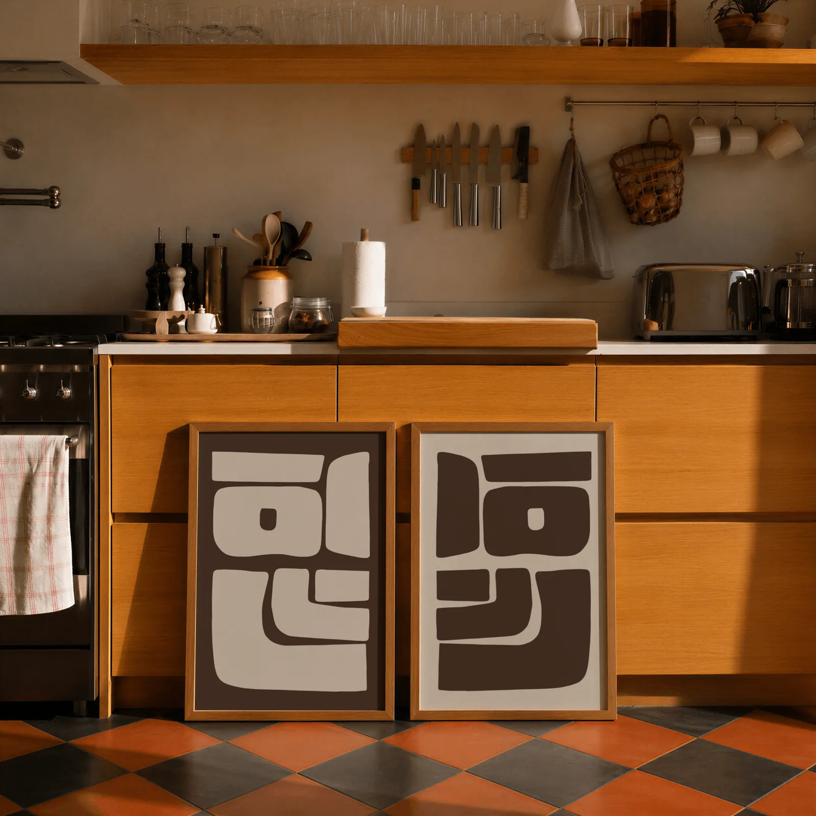brown beige abstract mid-century wall art set of 2, leaning against wooden cabinets on terracotta tiled floor