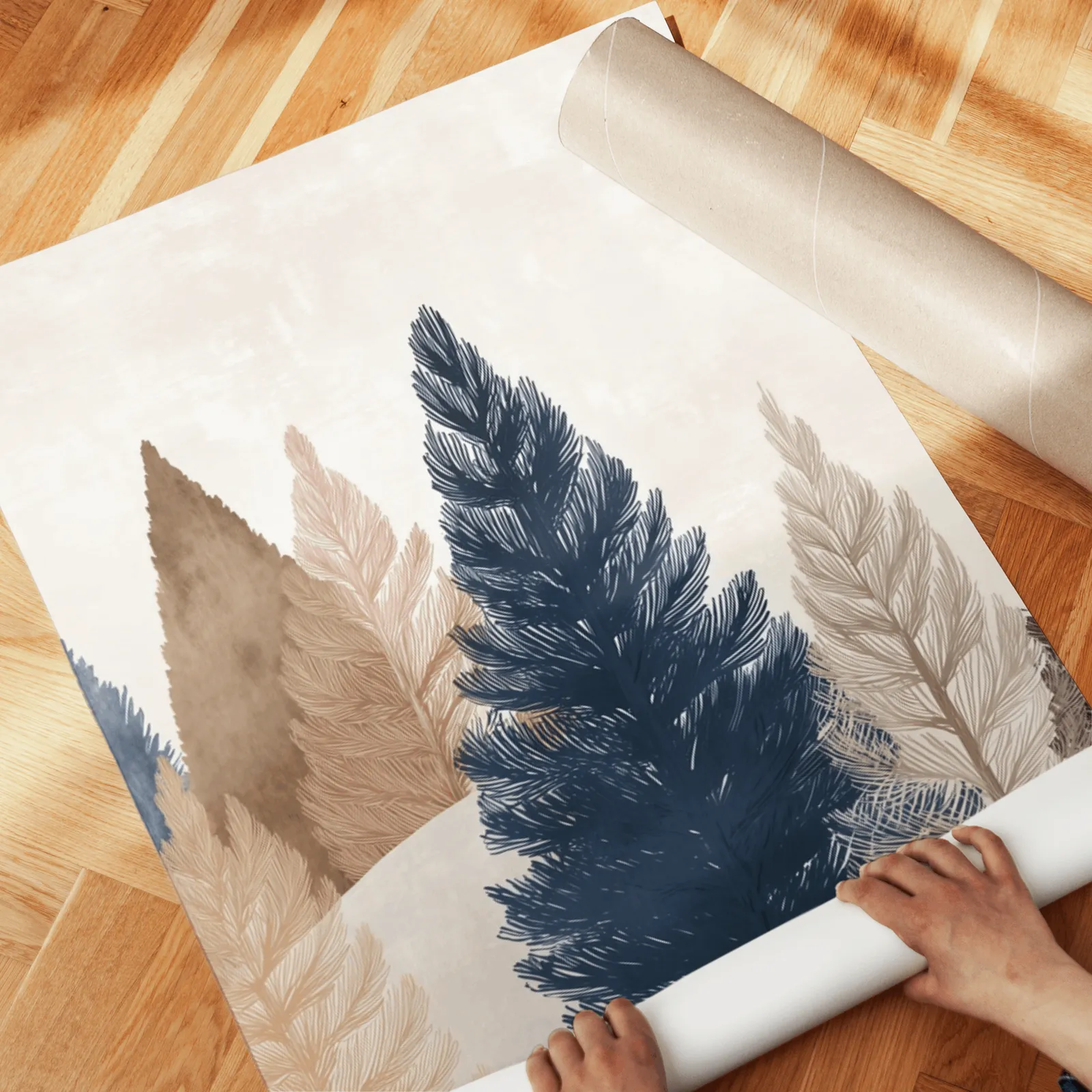 blue and brown pine tree wall art set of two, unrolled across a herringbone parquet floor by hand