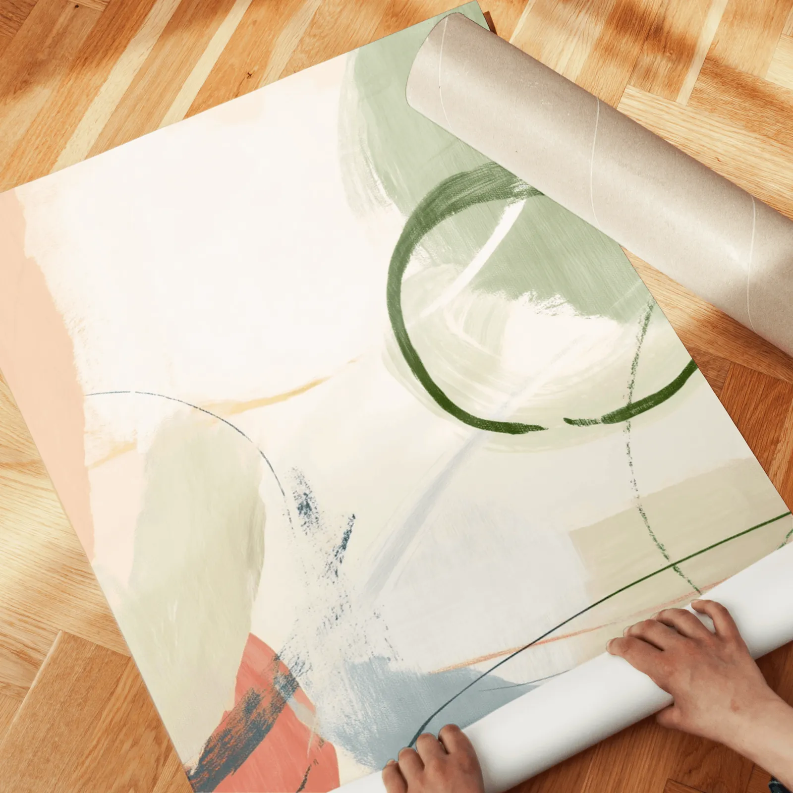 colorful abstract wall art set of 3, unrolled across a herringbone wood floor by hand
