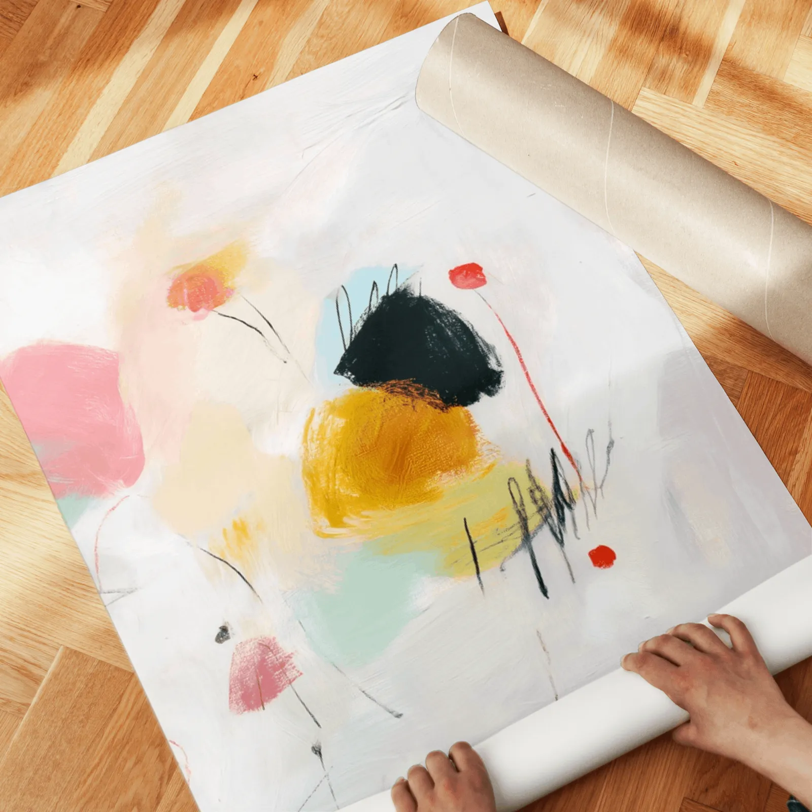 colorful abstract wall art set of two, unrolled across a herringbone parquet floor by hand