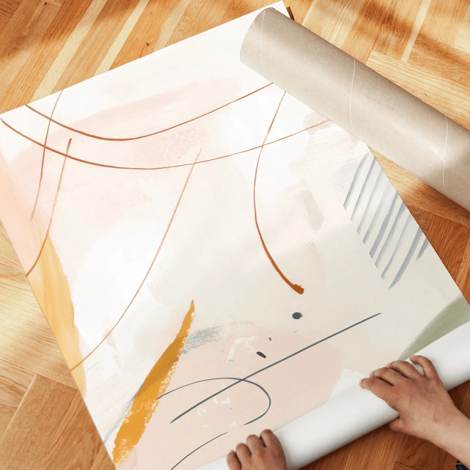 colorful abstract wall art set of three, unrolled across a herringbone wood floor by hand