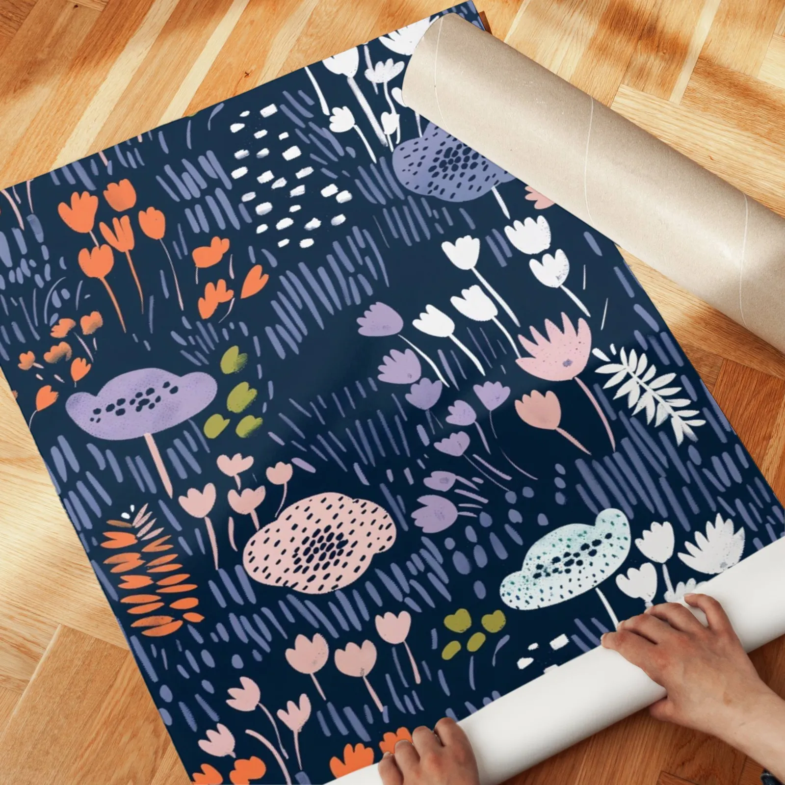 navy floral botanical wall art print, unrolled across a herringbone parquet floor by hand